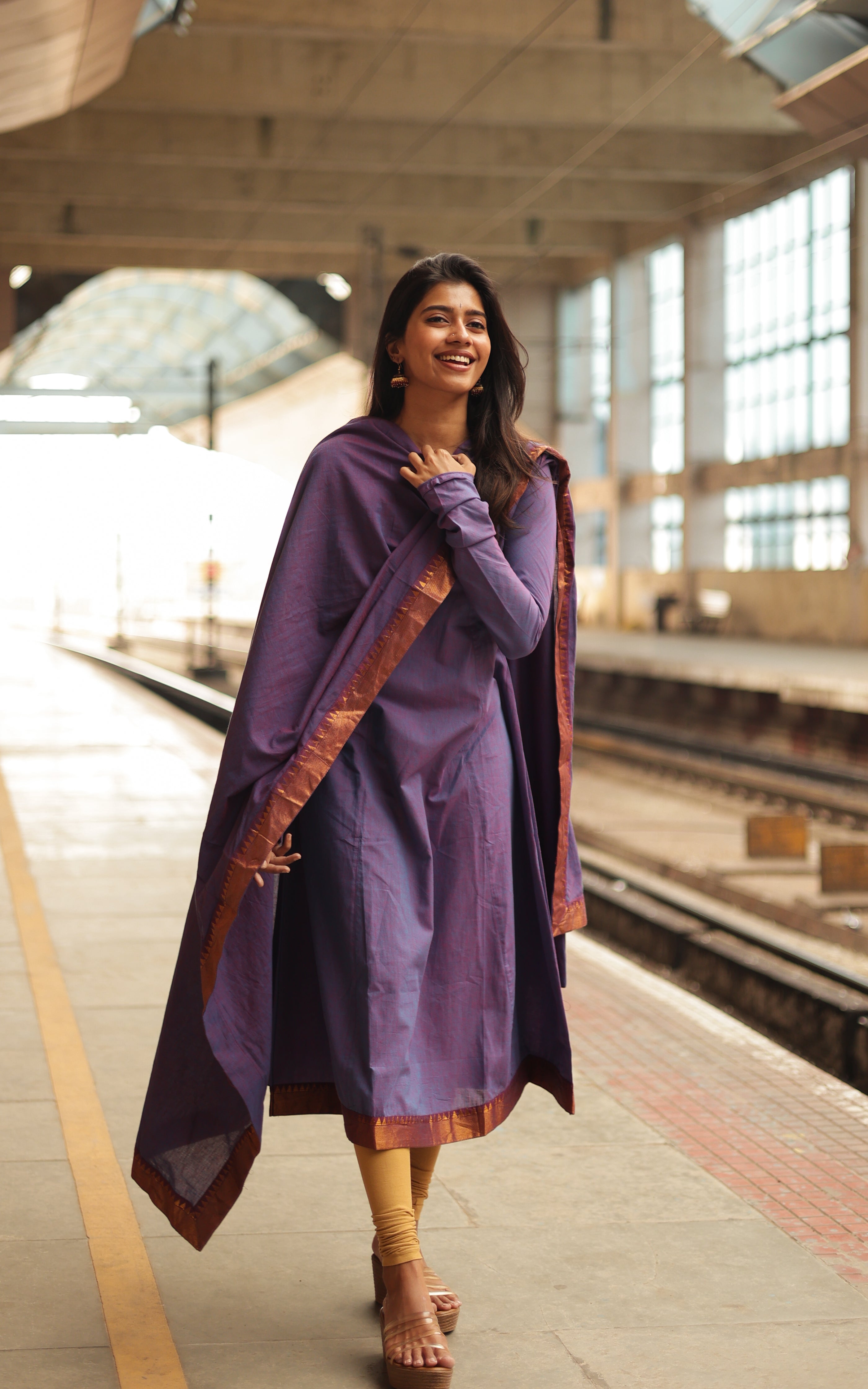 An elegant Aline kurti with side slits, The kurti has long sleeves and a simple boat neckline, add a stylish touch to the design.