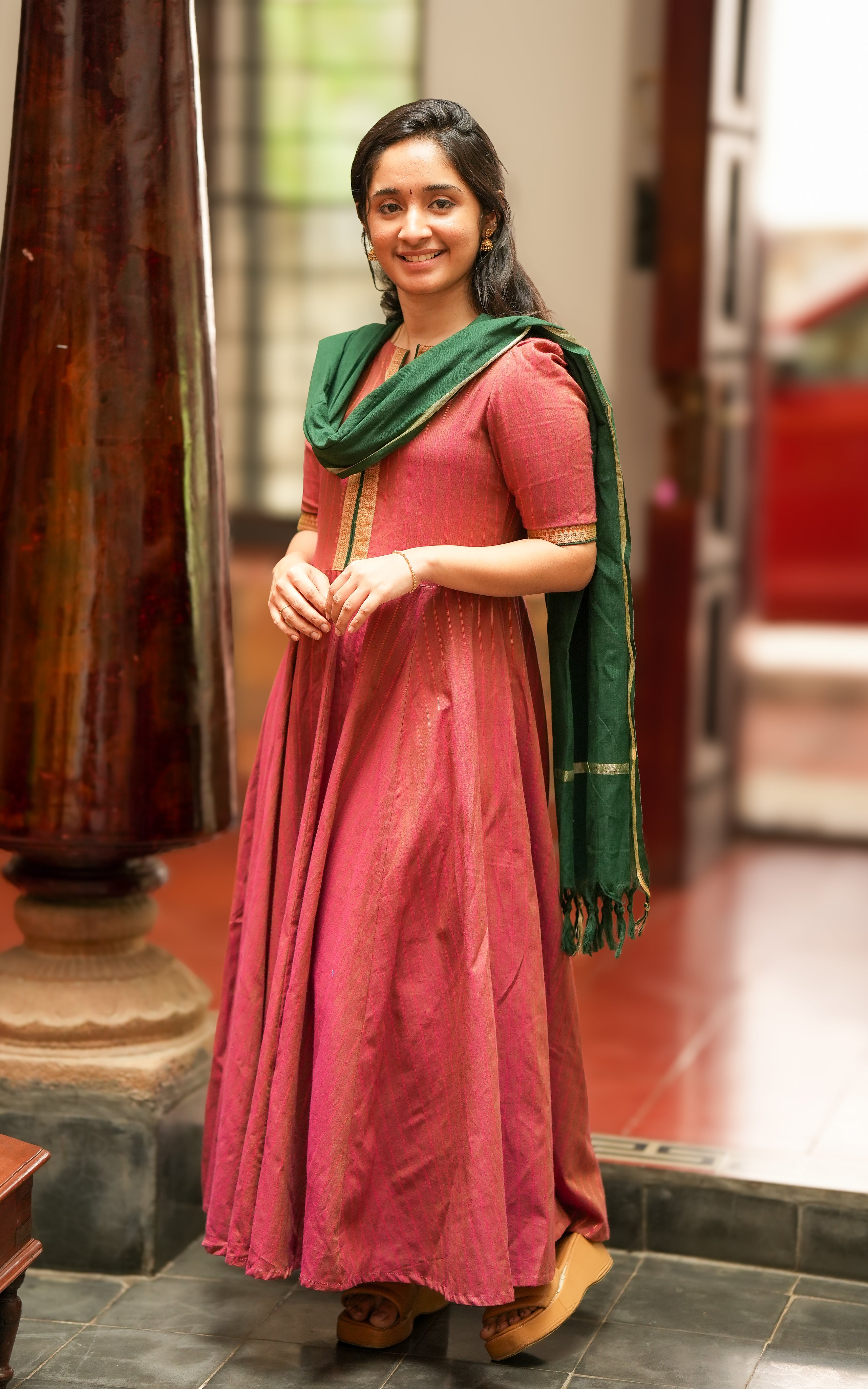 Elbow-length sleeves are finished with golden embroidered borders, matching the look from Annapoorani.
