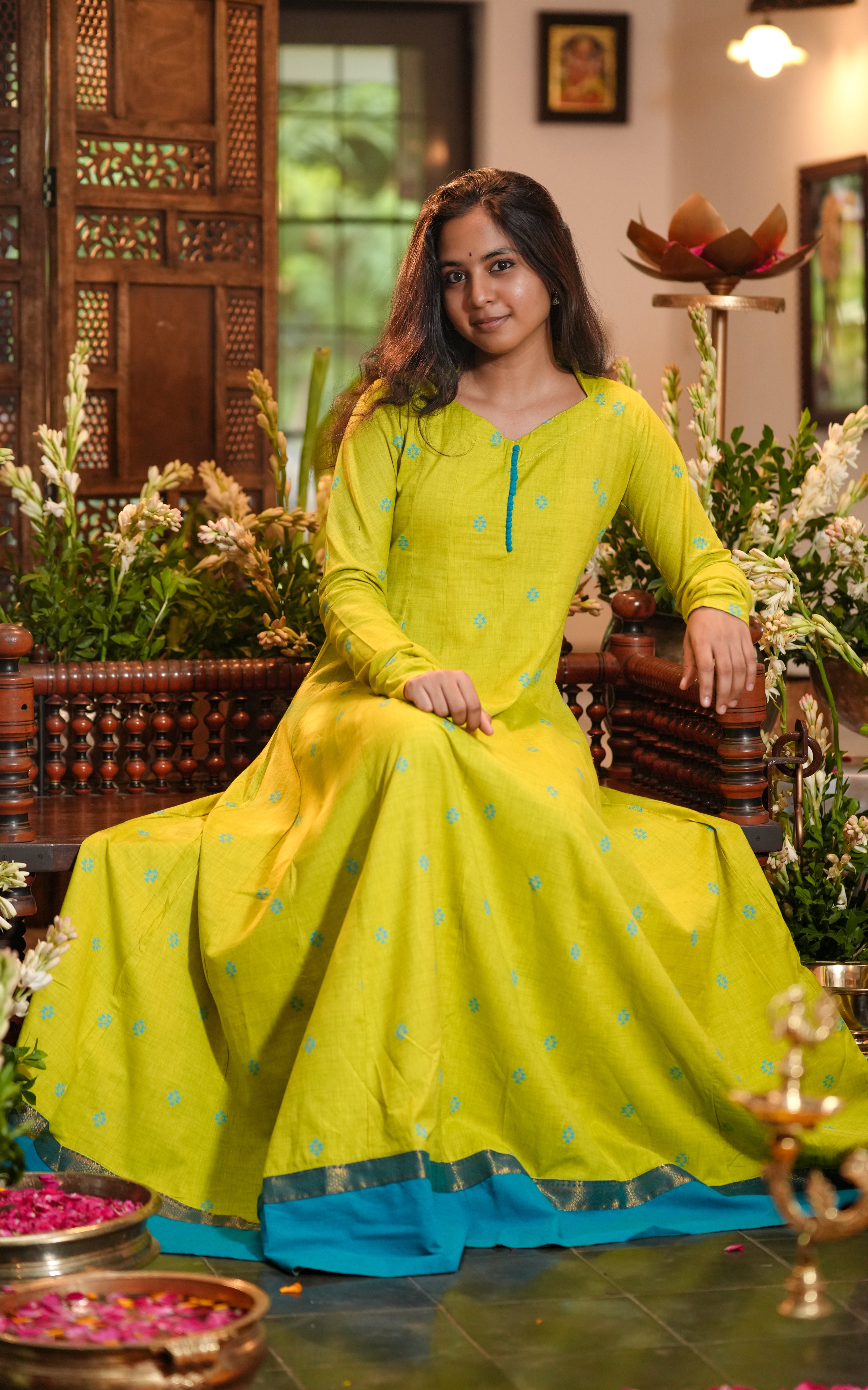 The gathered full sleeves extend beyond the wrists for an elegant, flowy look.