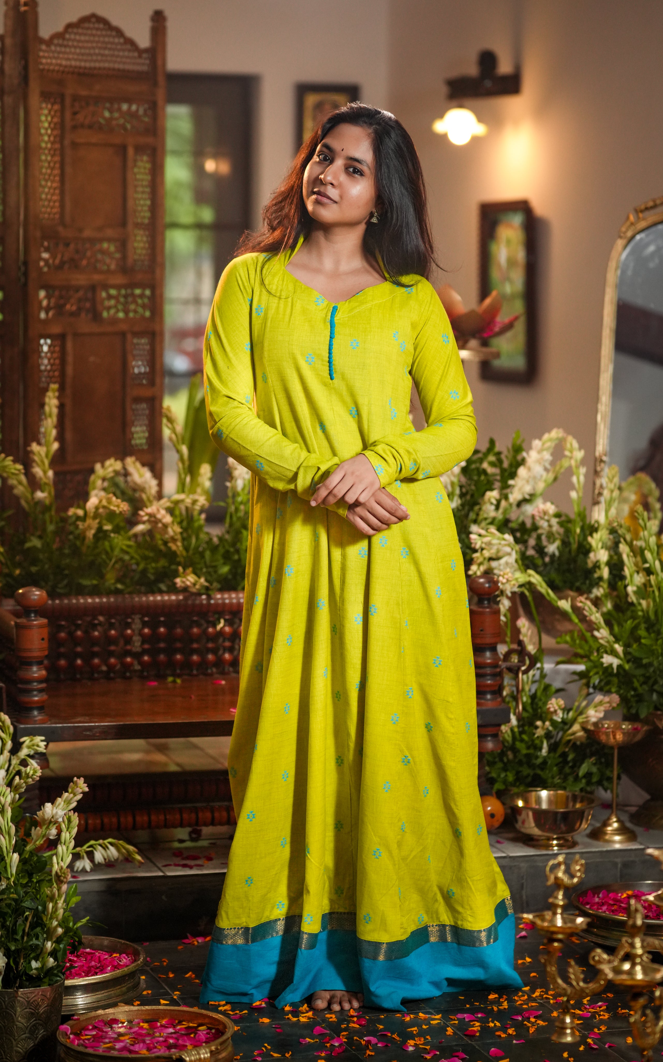 Anarkali features scattered blue thread motifs on a lime green background.