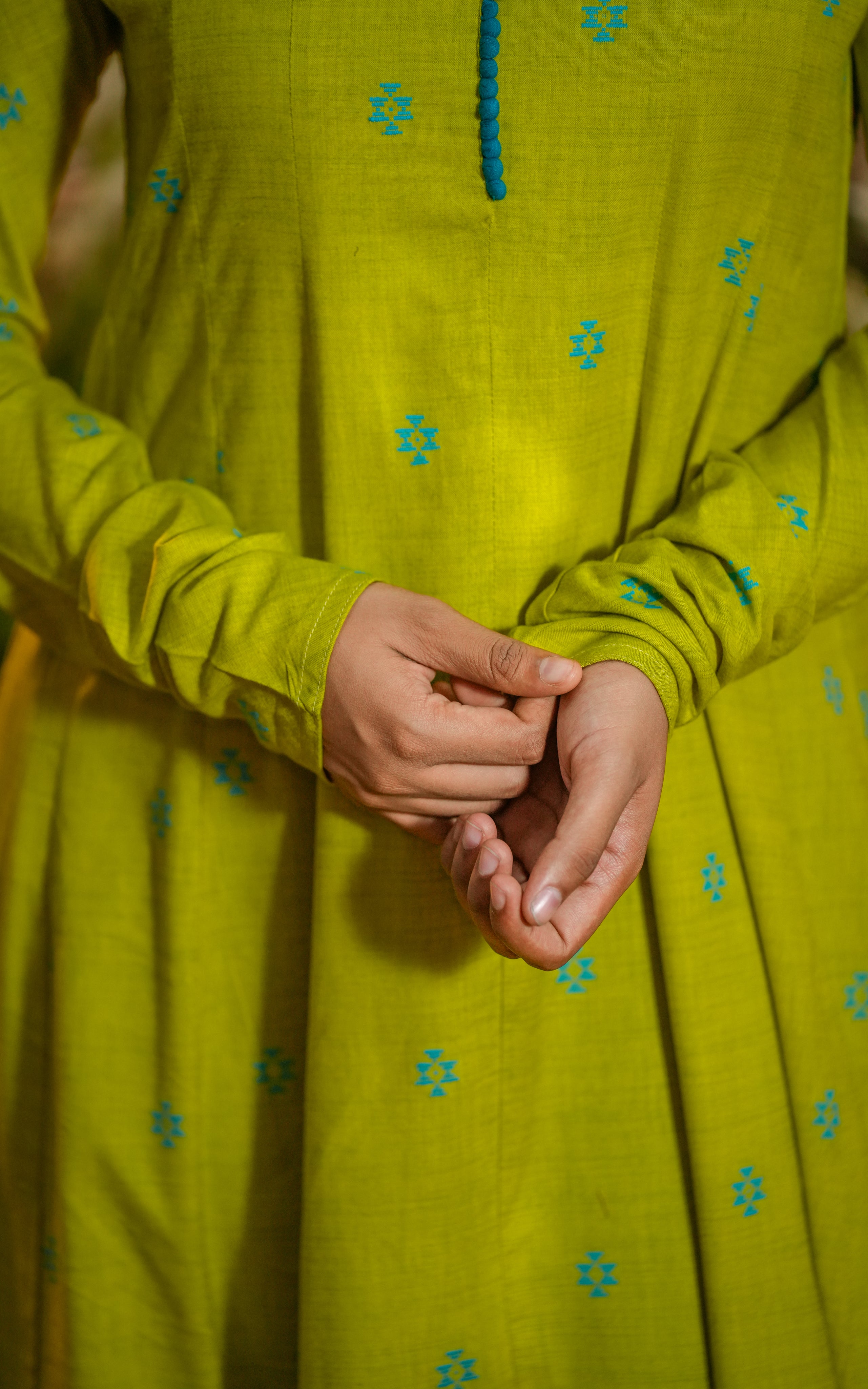 This full-length Anarkali reaches the ankles, emphasizing the grandeur of the look.