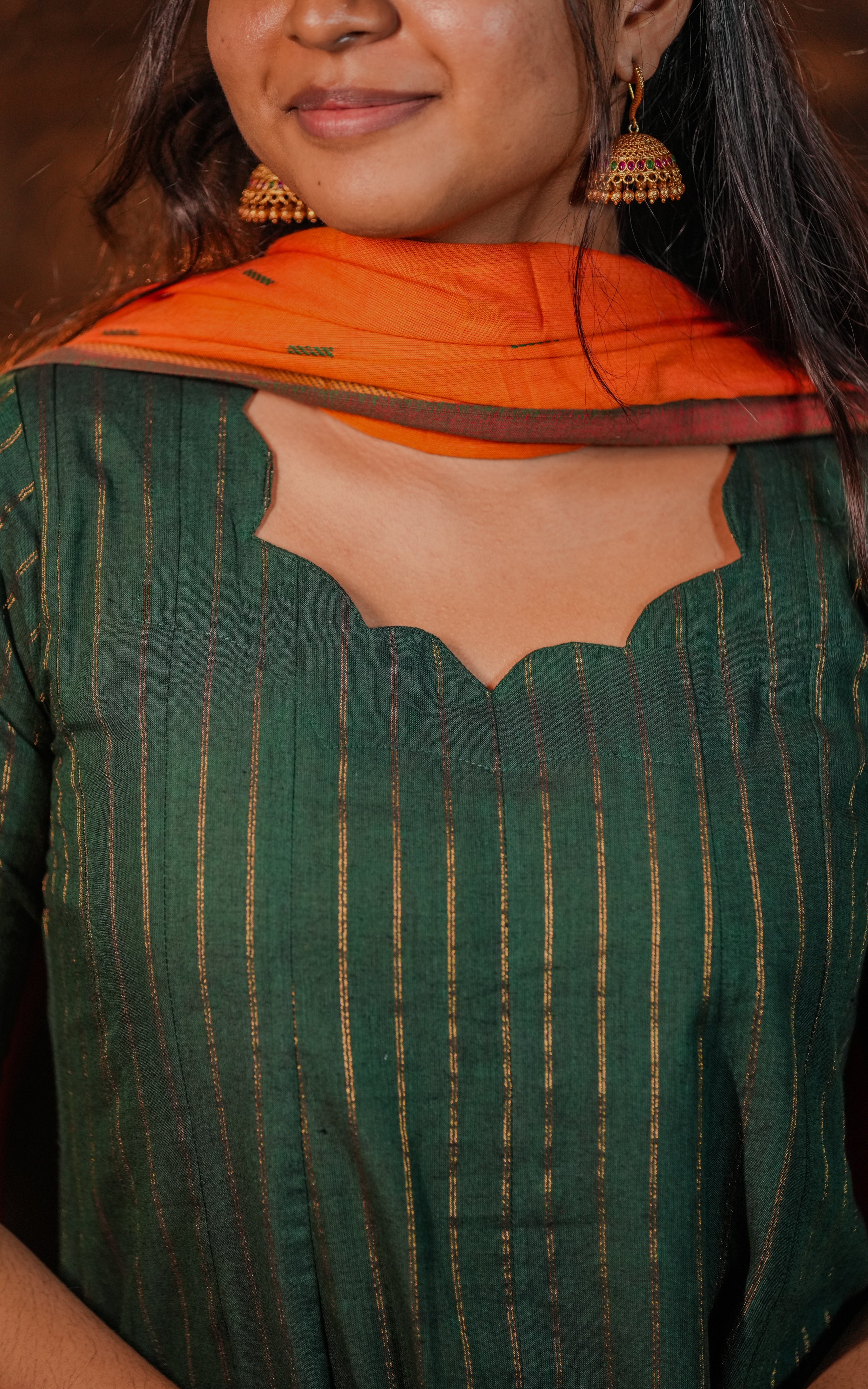 The golden lines on the kurti are likely zari work.