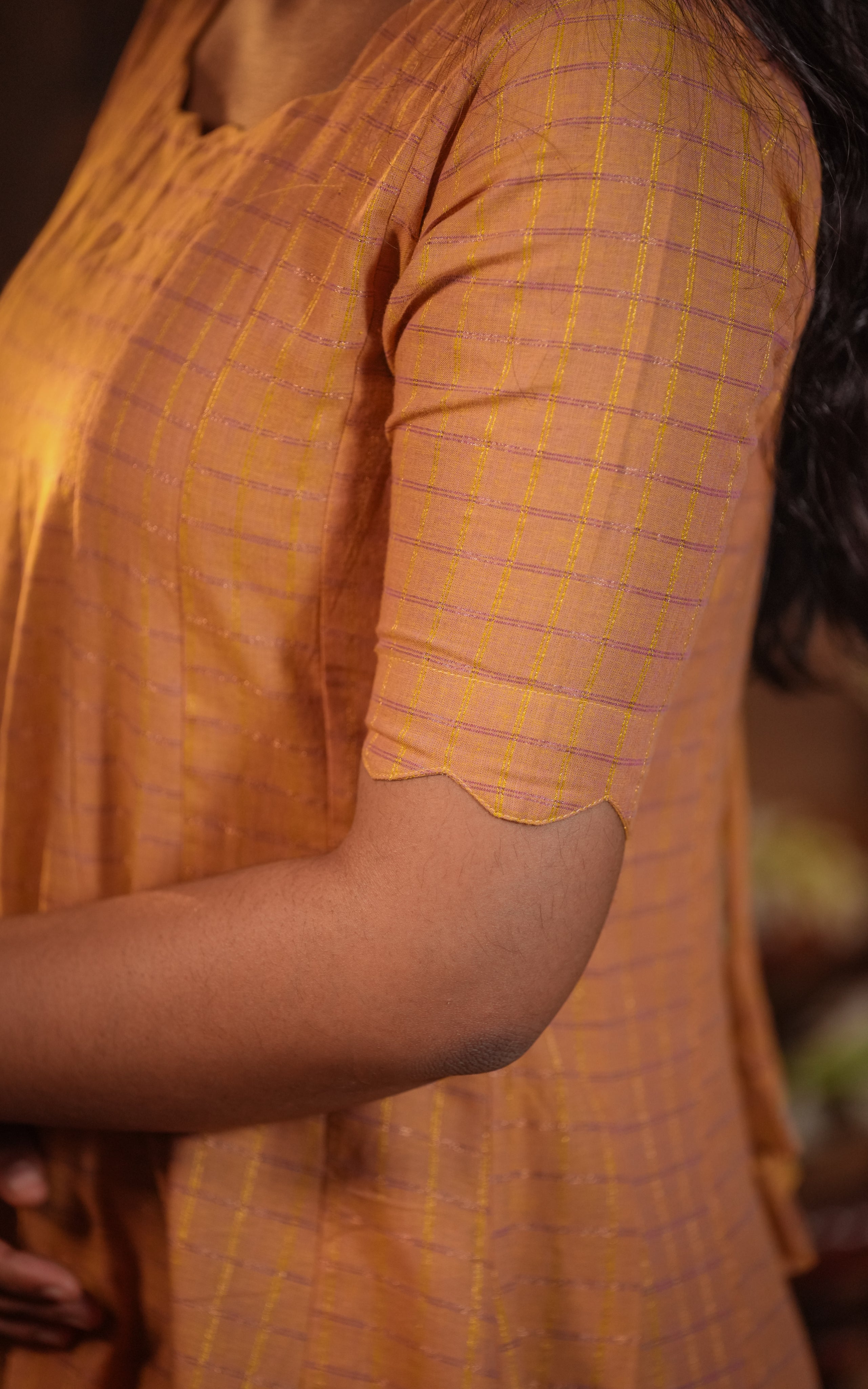 Dress ends with a dark purple woven zari border at the hem.