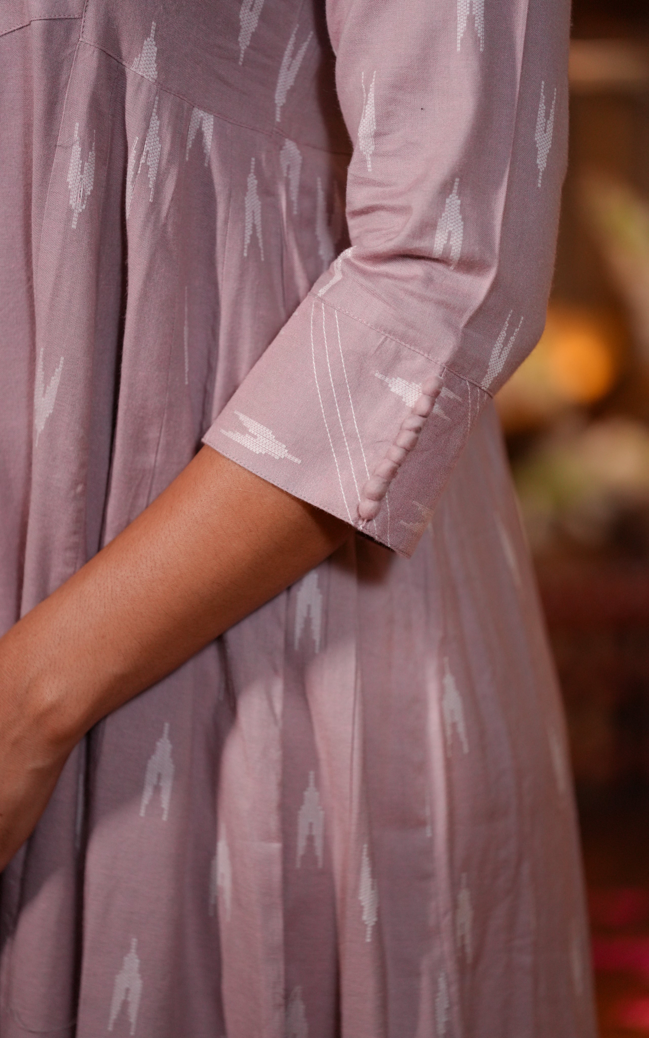 The pastel pink tone makes it a good choice for daytime wear or temple visits.