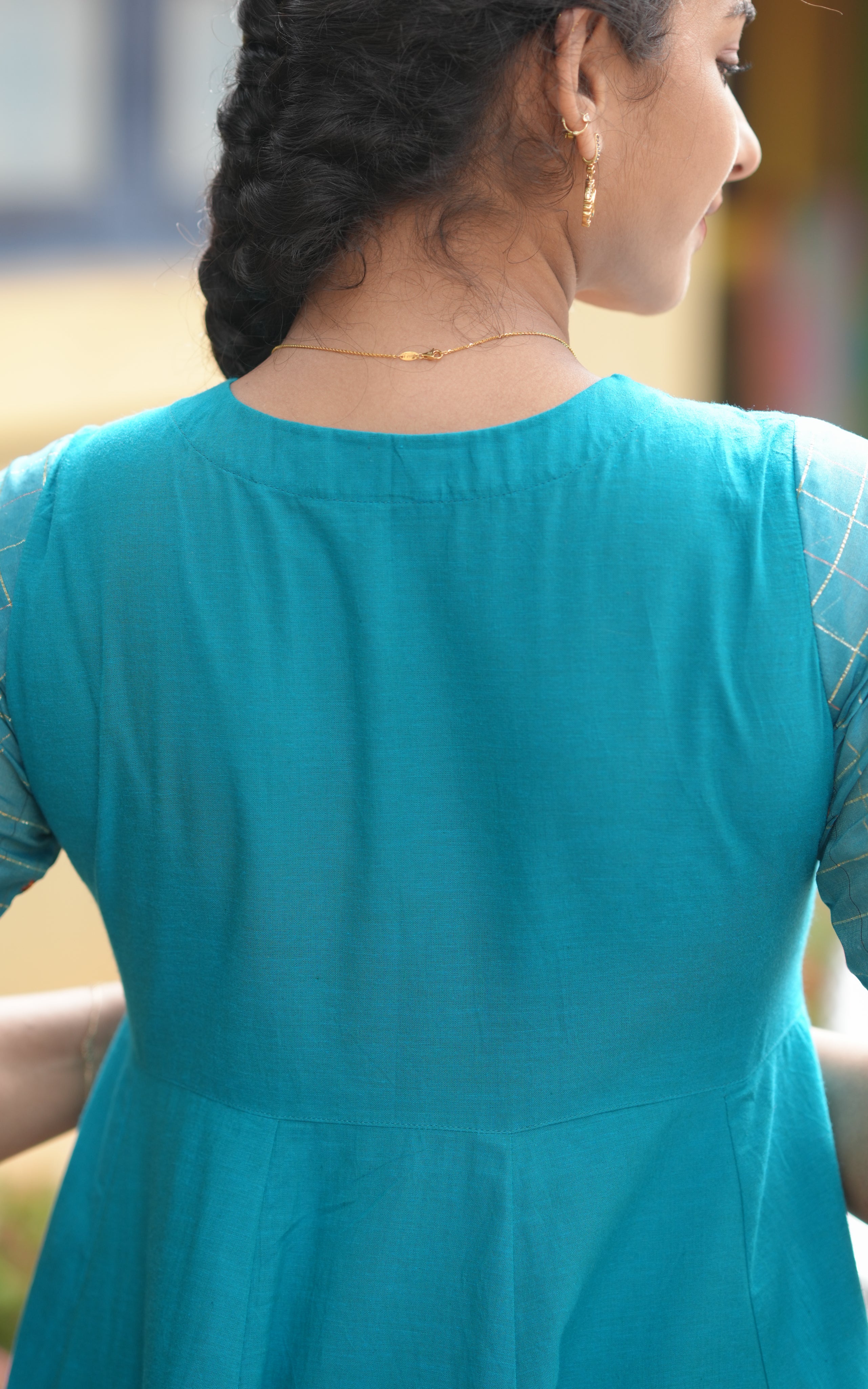 Woman wearing a teal dress