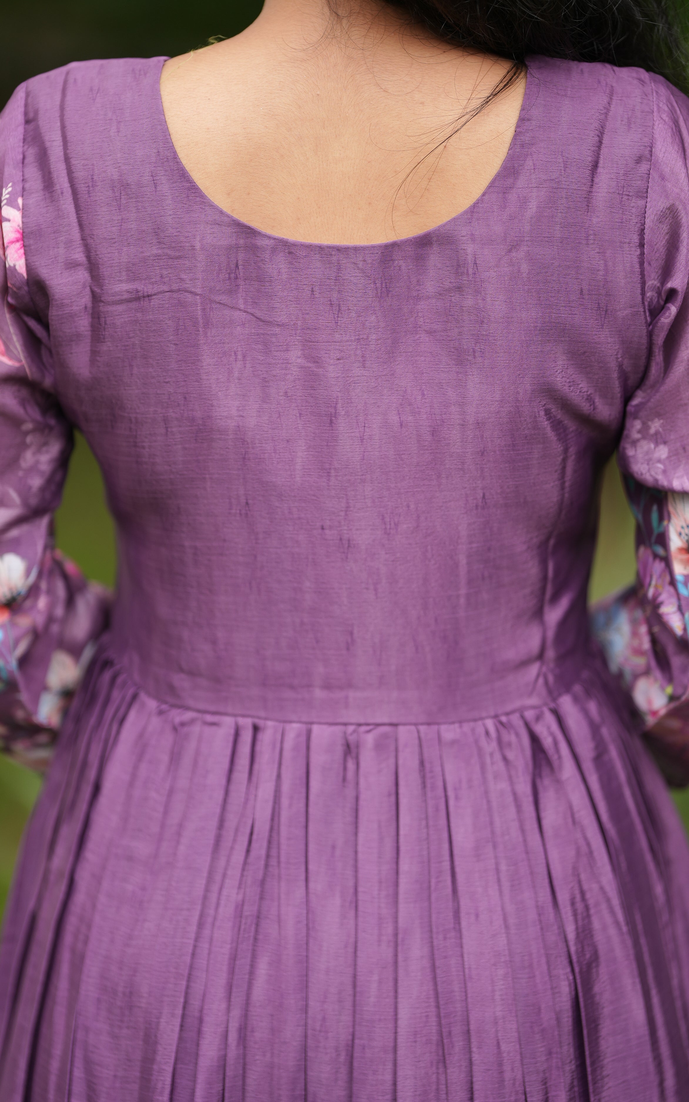 Back neckline features a modest round shape