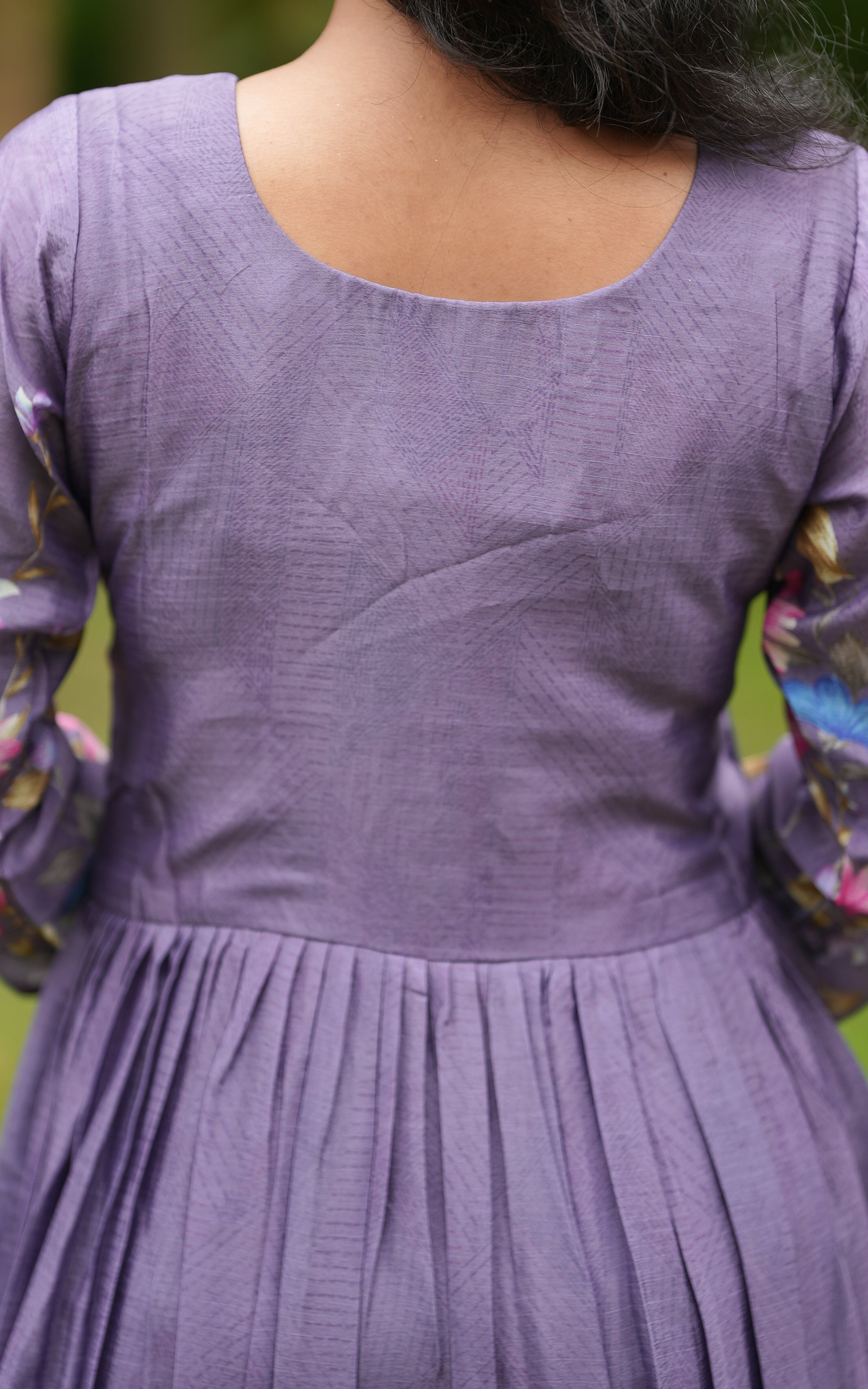 Back neckline features a modest round shape