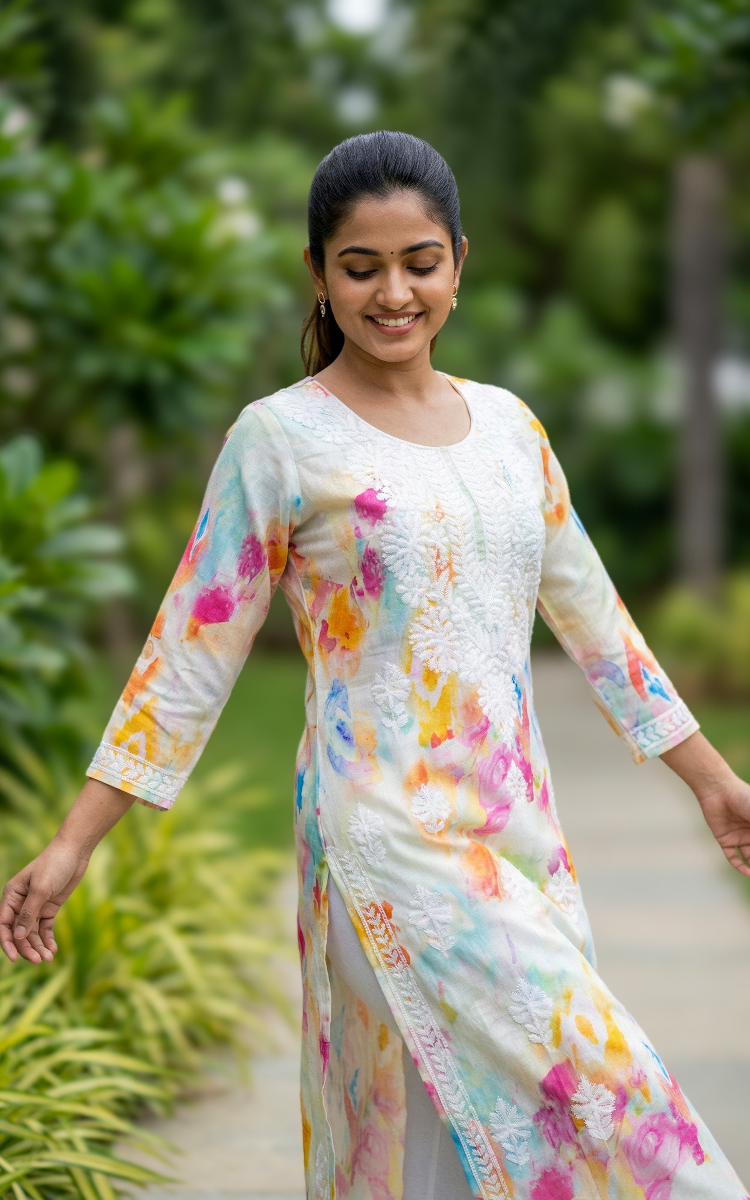 white ethnic chikankari kurti
designer cotton embroidered kurti
festive cotton kurti for women
traditional straight cut kurti with side slit