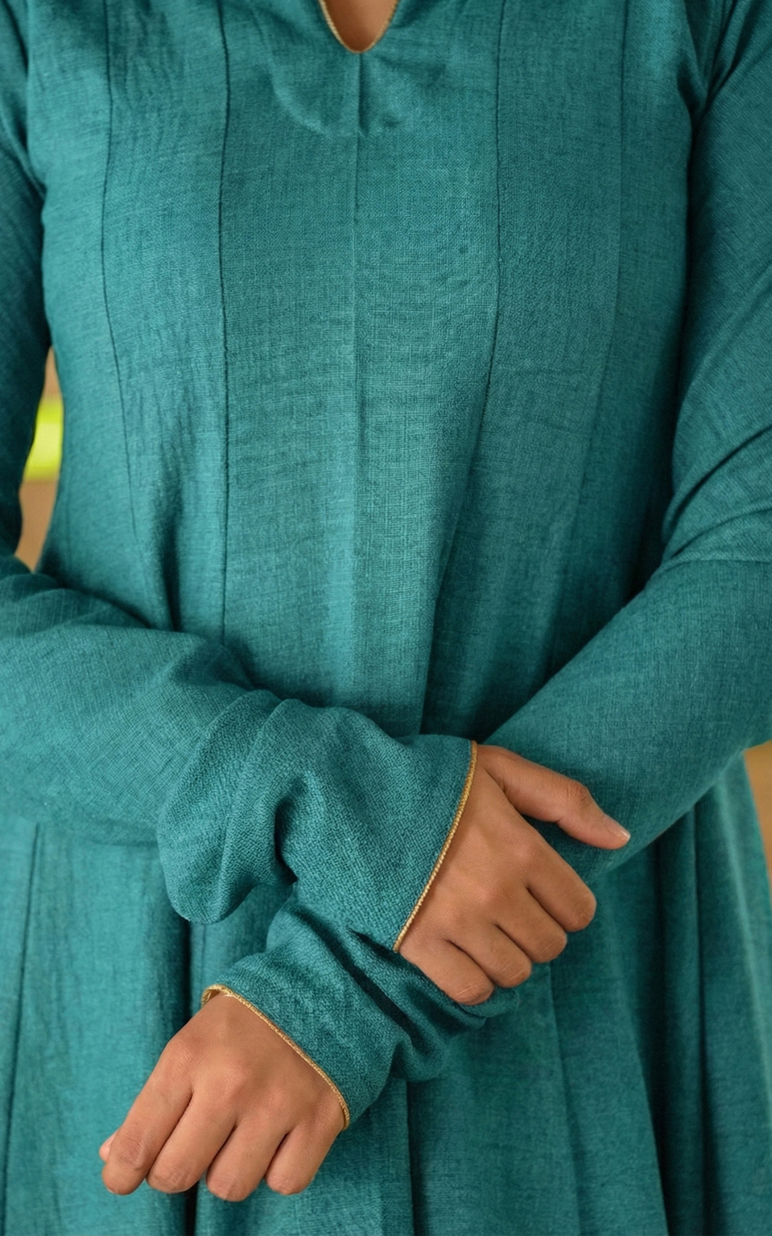 Instore - Teal Anarkali style kurti with gathered sleeves and decorative golden piping & thick slub synthetic fabric