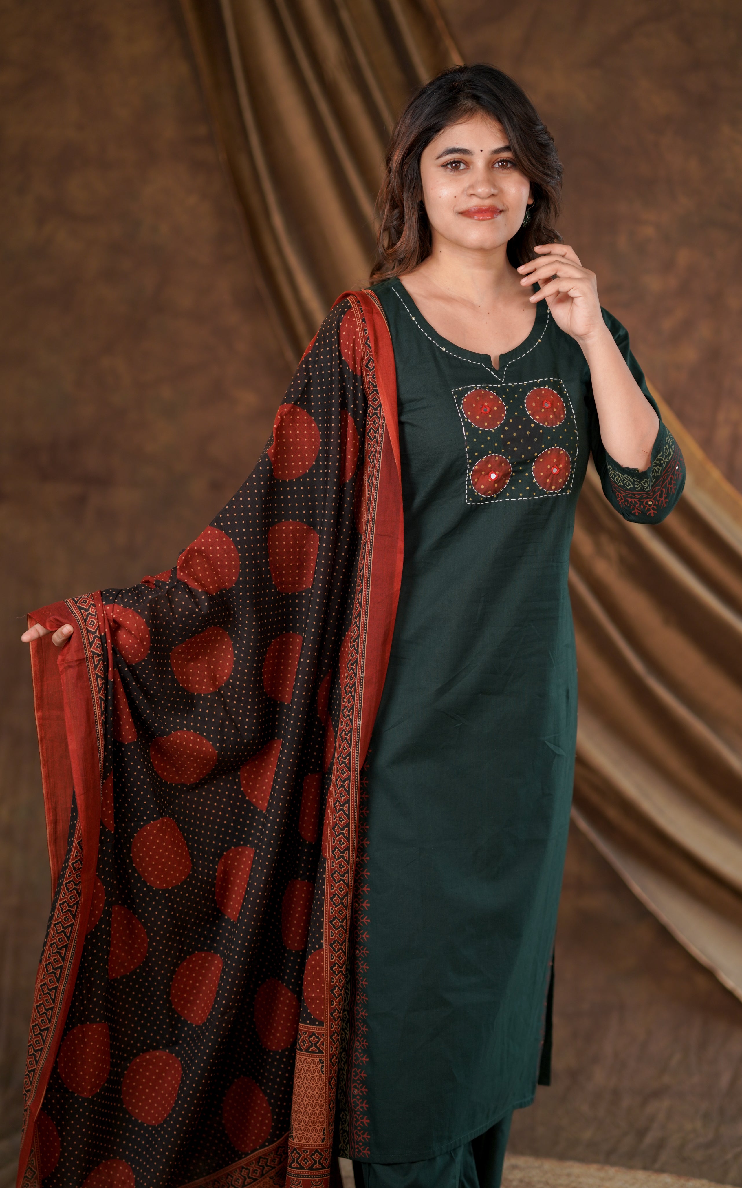 Dark green straight-cut kurta with neat round-notch neckline for a clean stylish look
