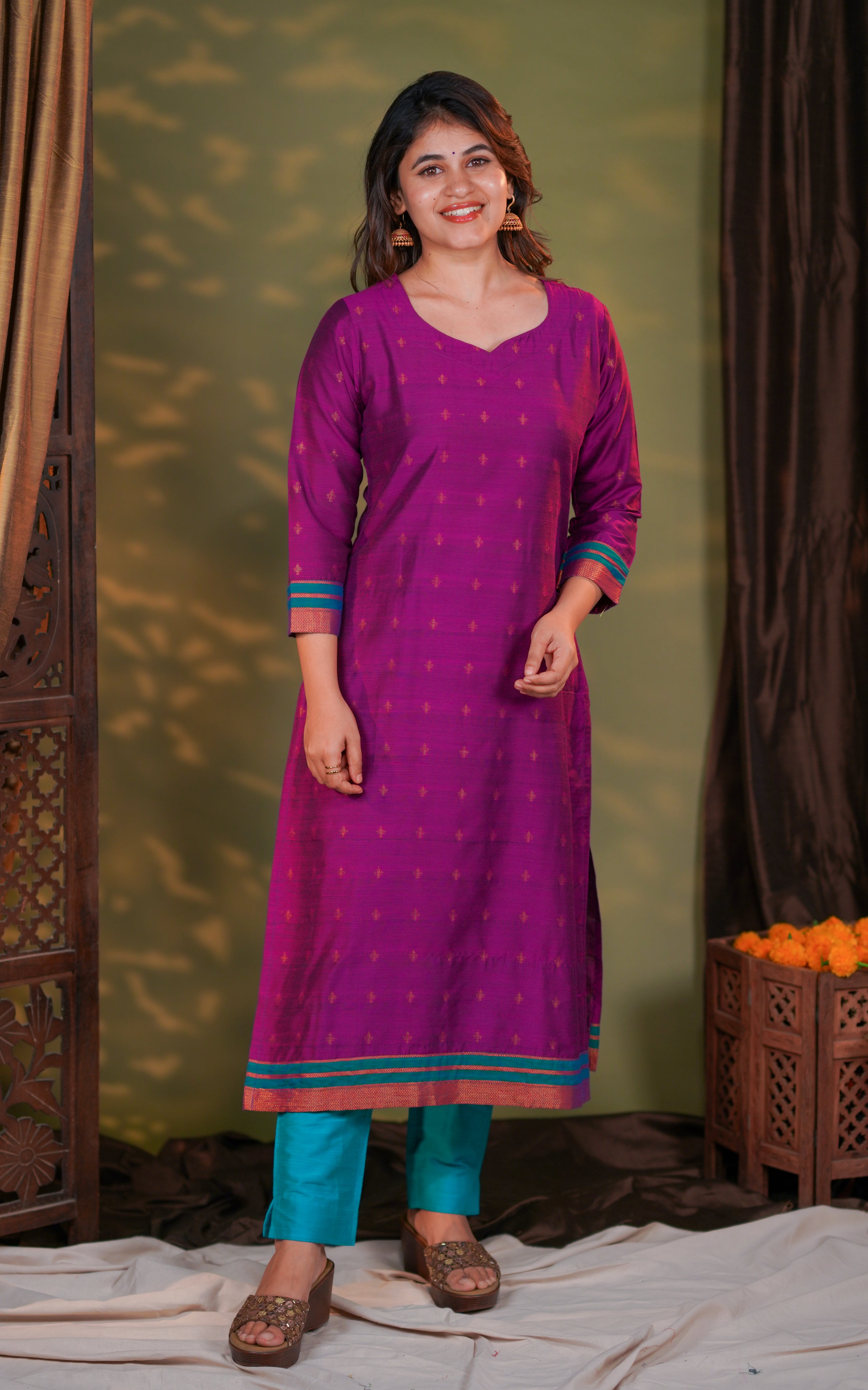 fabric includes subtle woven golden motifs that enhance its festive appeal,three-fourth length with contrast teal and gold borders for an eye-catching designer finish.