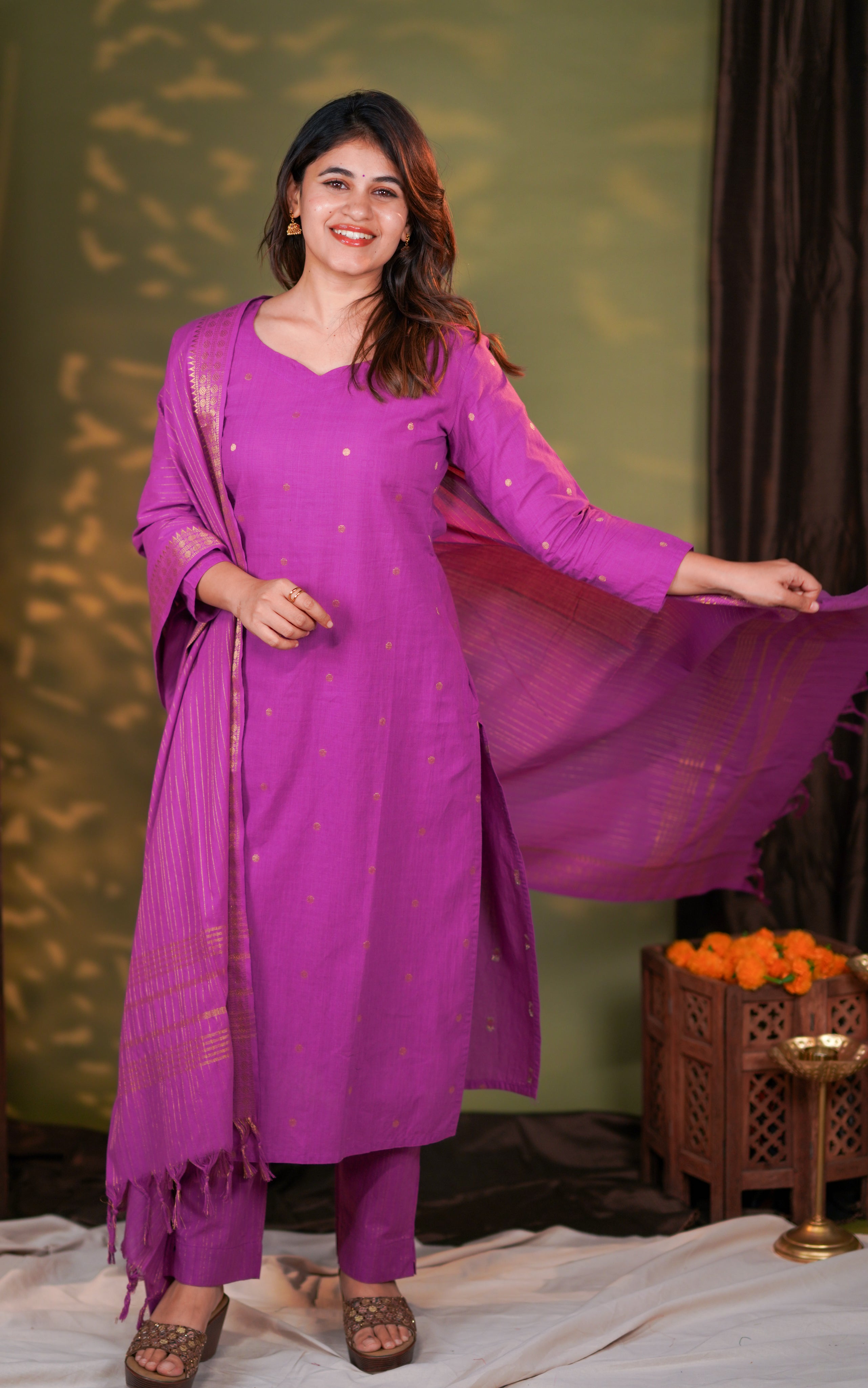 straight pants and a flowy dupatta enriched with shimmering zari borders