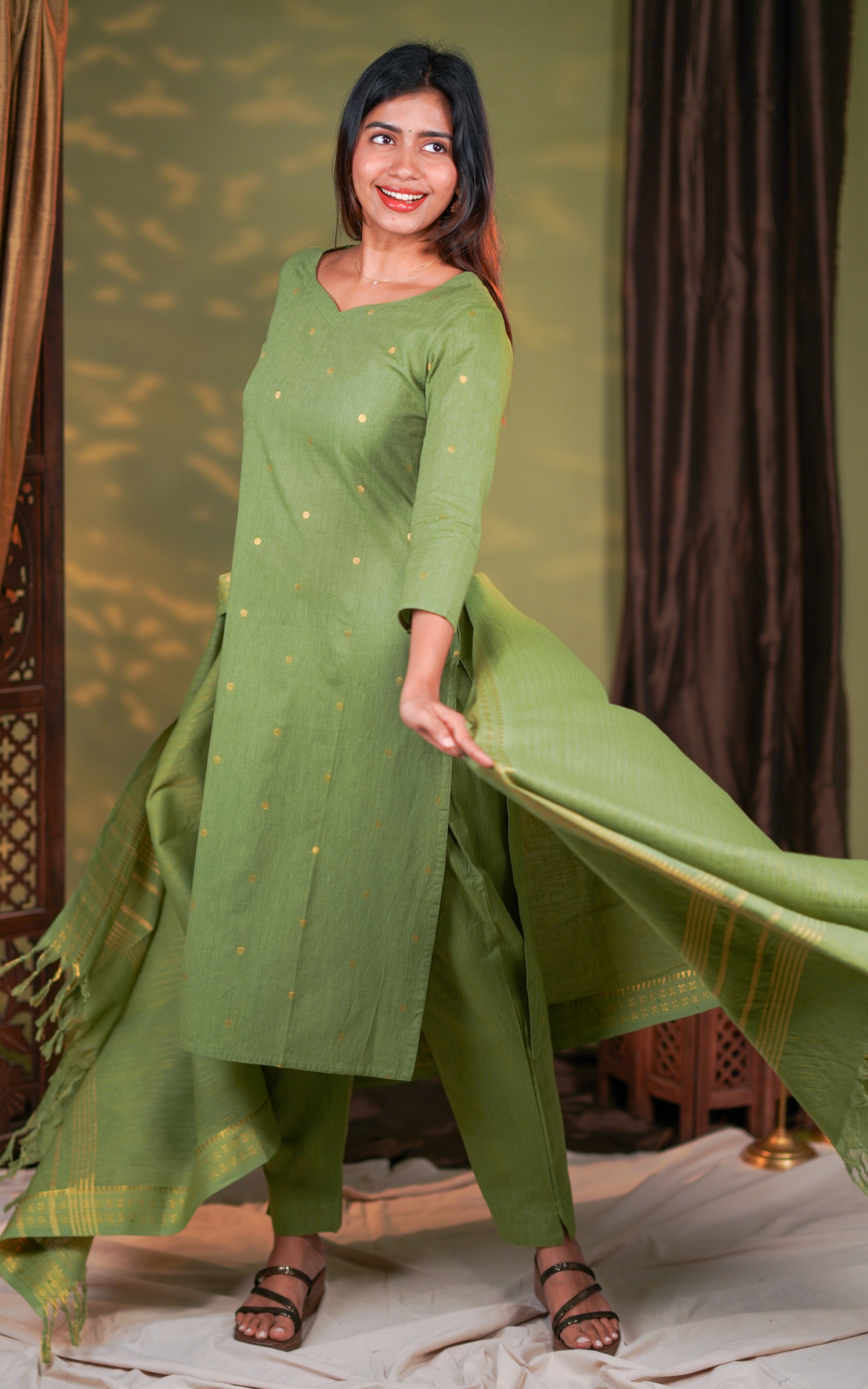 straight pants and a flowy dupatta enriched with shimmering zari borders.