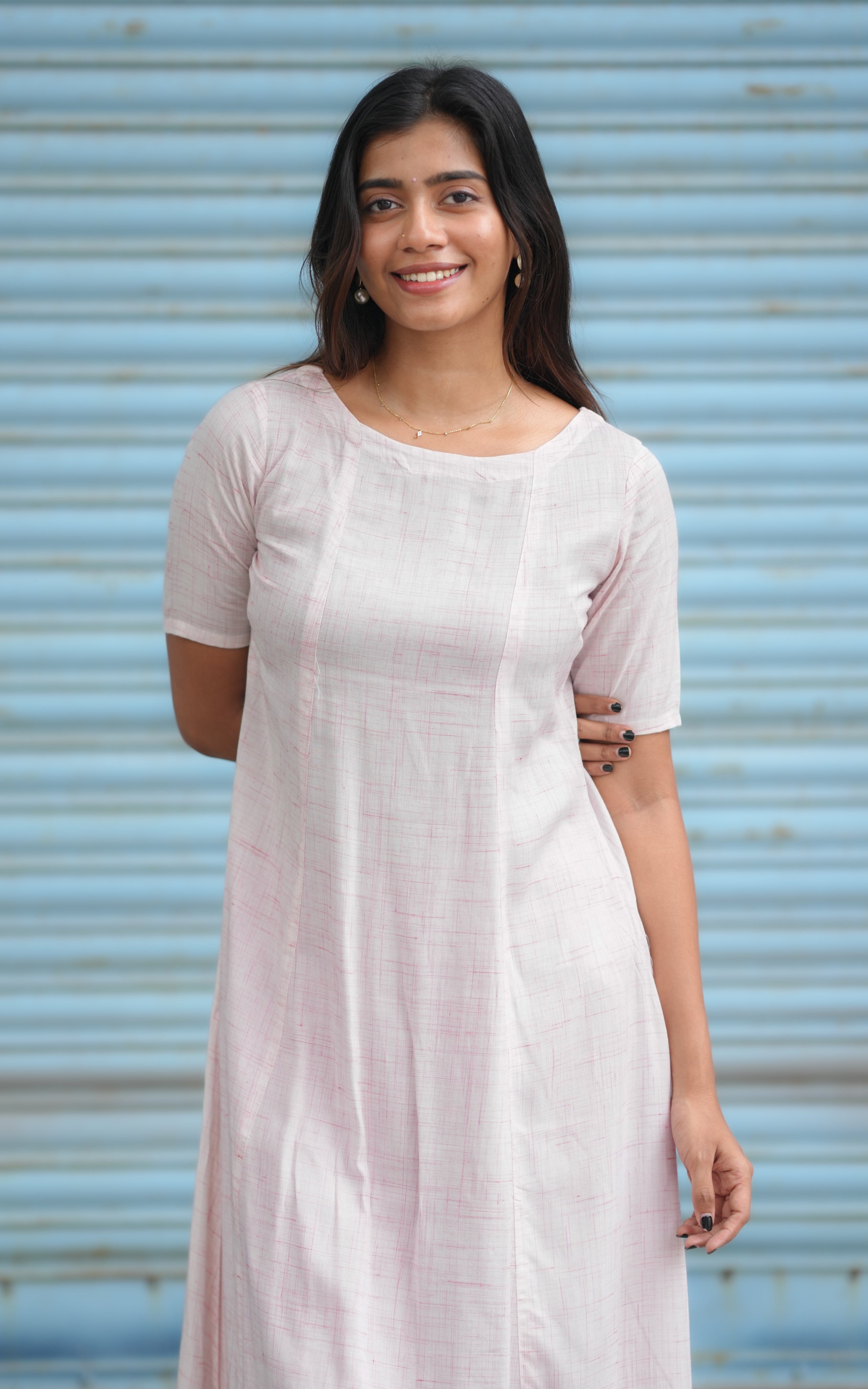 Woman wearing a light pink dress