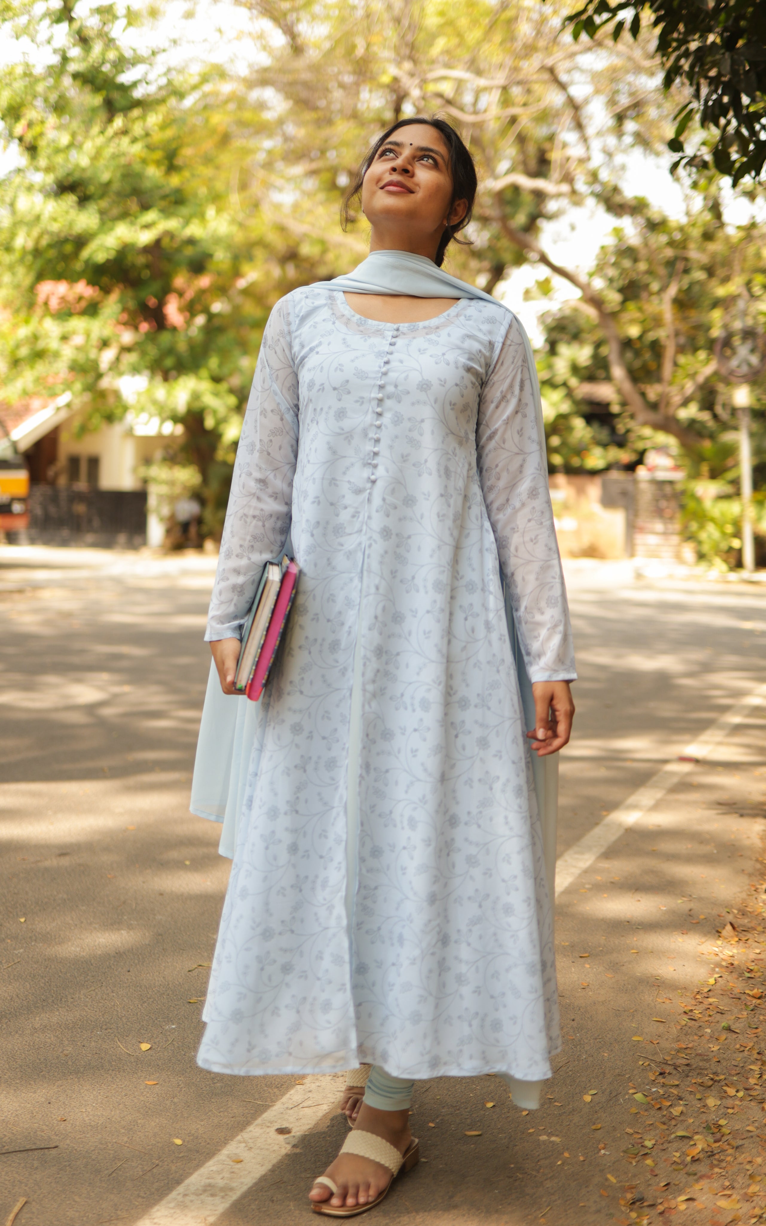 Features a layered A-line kurti paired with a matching dupatta