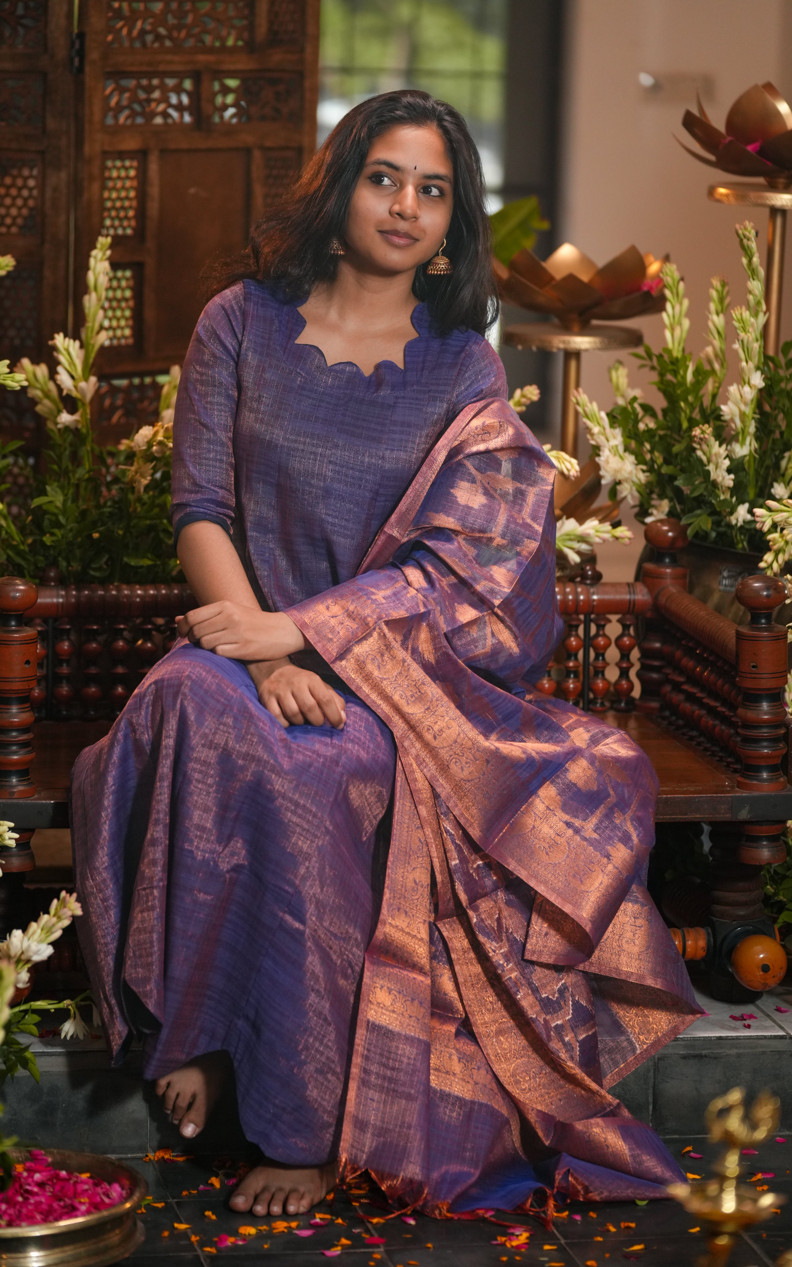 Full-length Anarkali in art textured silk fabric with metallic sheen and structured flare.