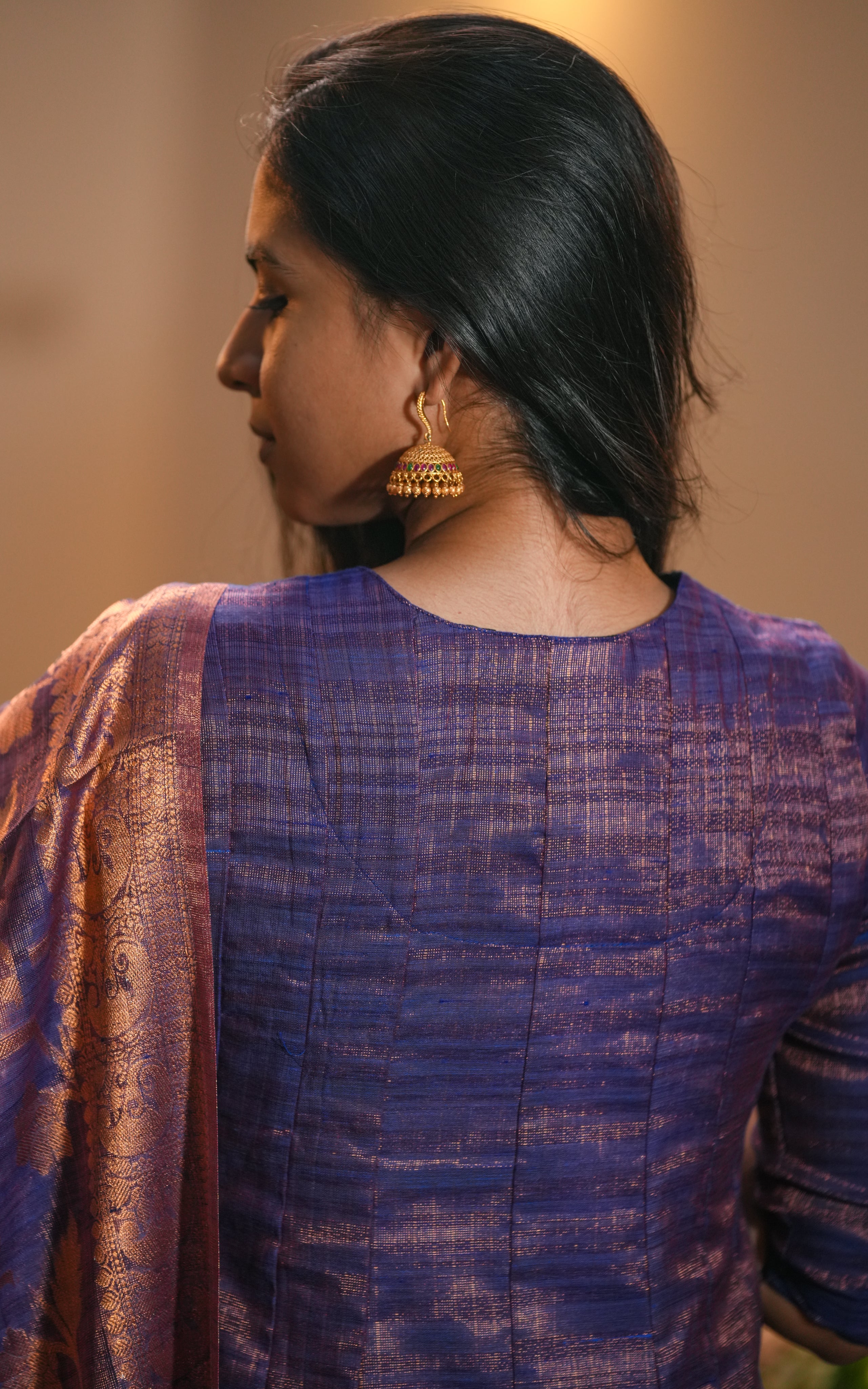 Art textured silk reflects light beautifully, enhancing the garment’s richness.