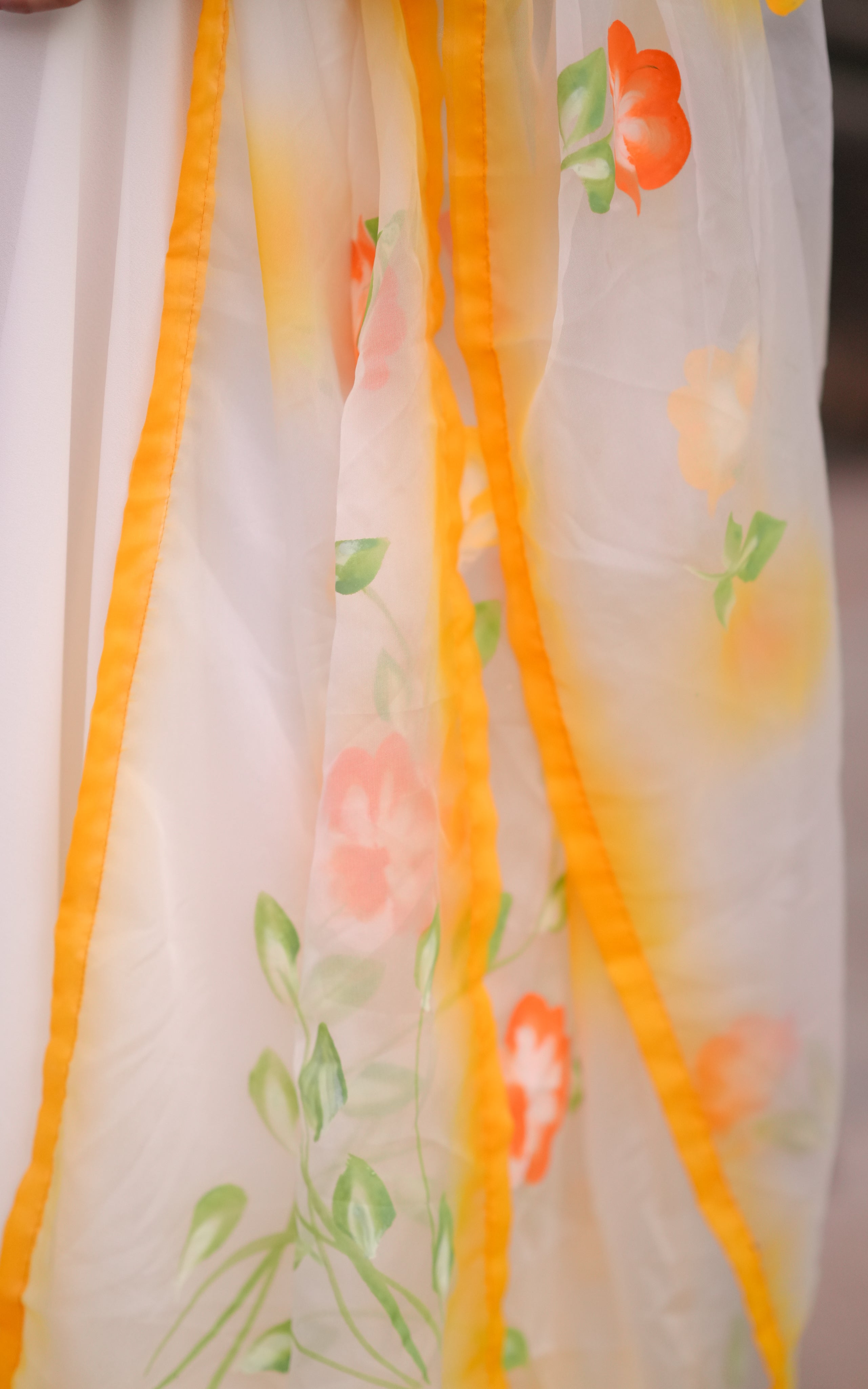 Floral print on dupatta adds charm & Yellow border enhances contrast