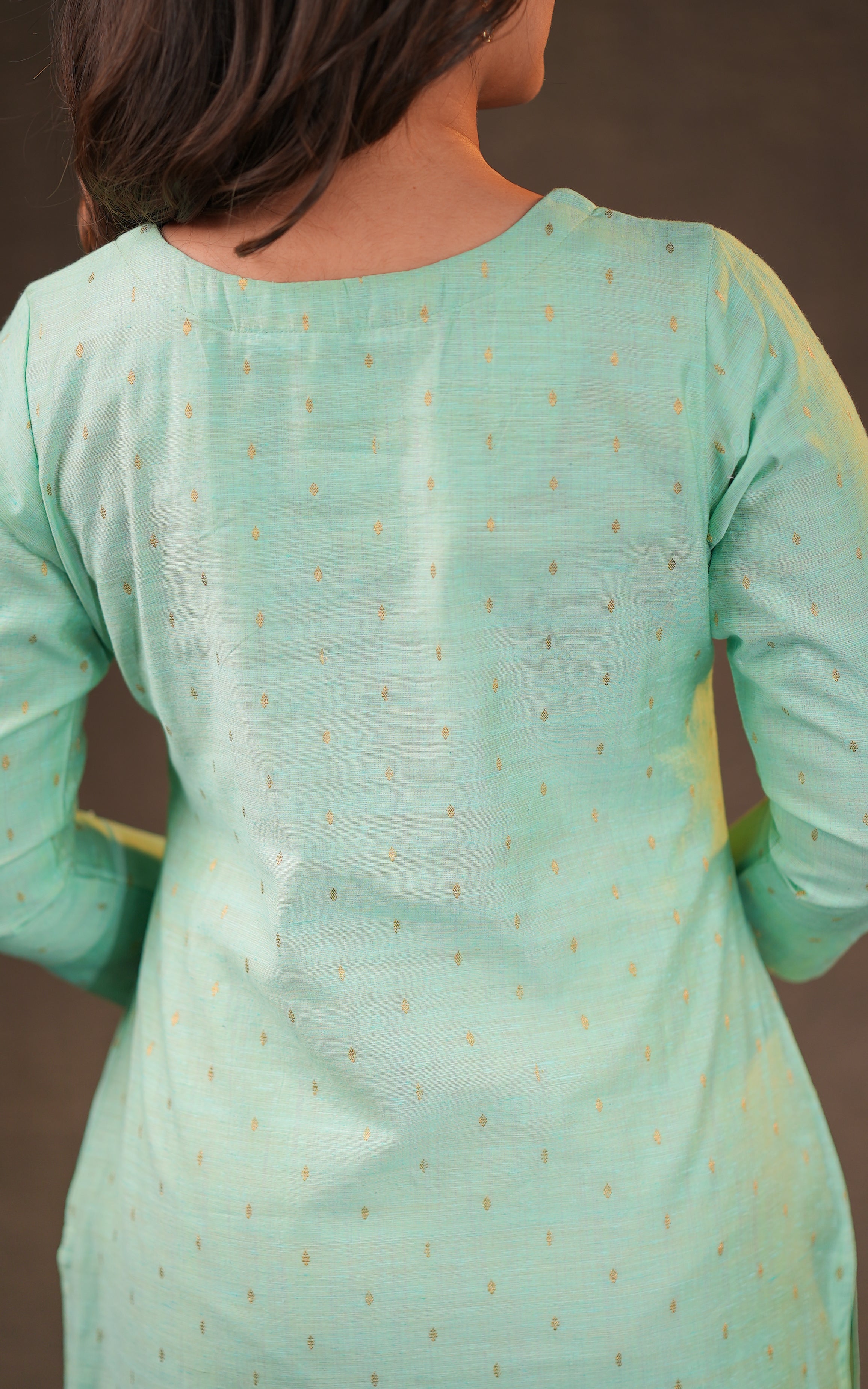 Instore - Pastel Green Color Silk Cotton V-Neck Straight Cut Kurti with Side Slits, & Golden Zari Butta & Butter Crepe Lining