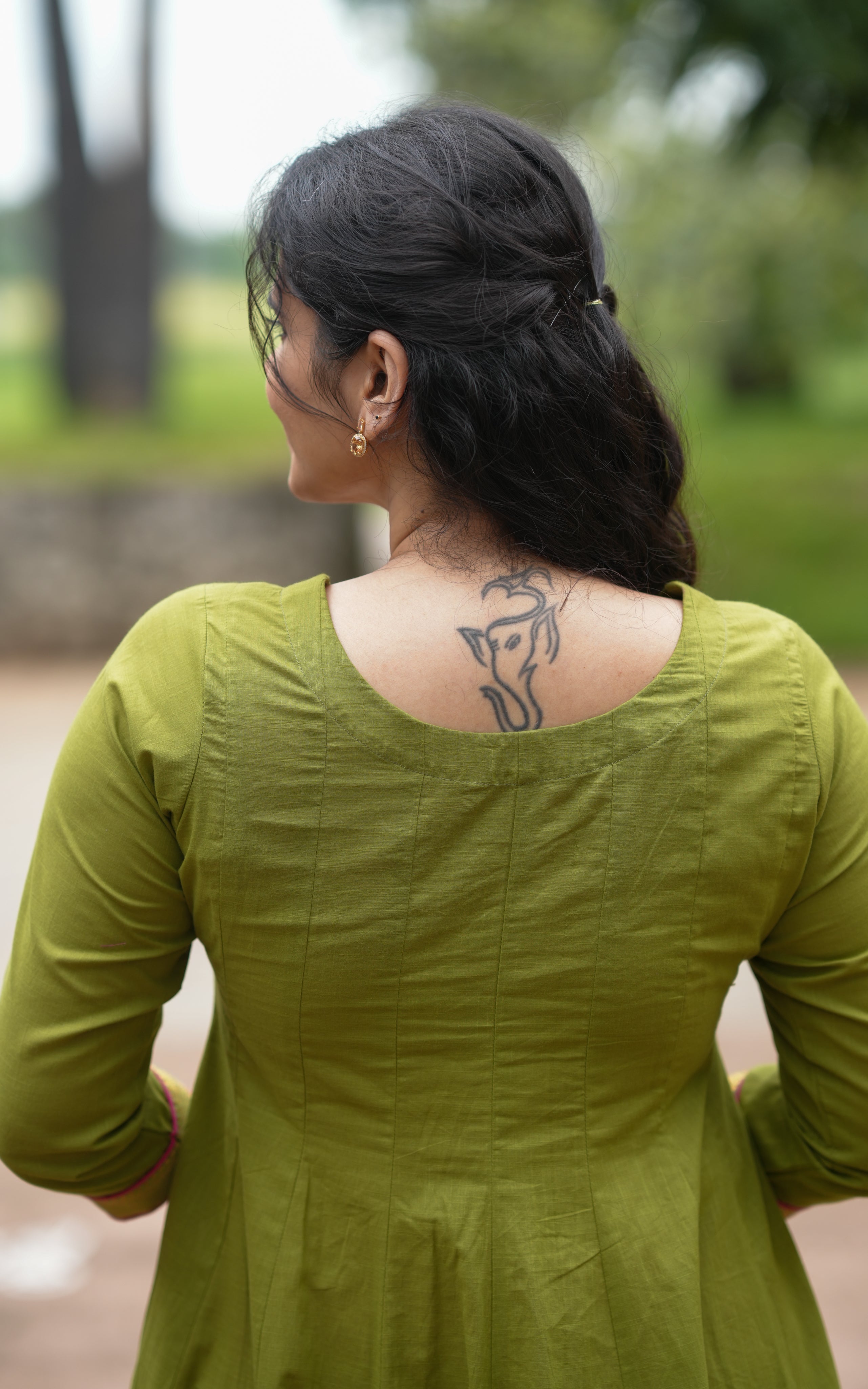 Back neckline features a modest round shape