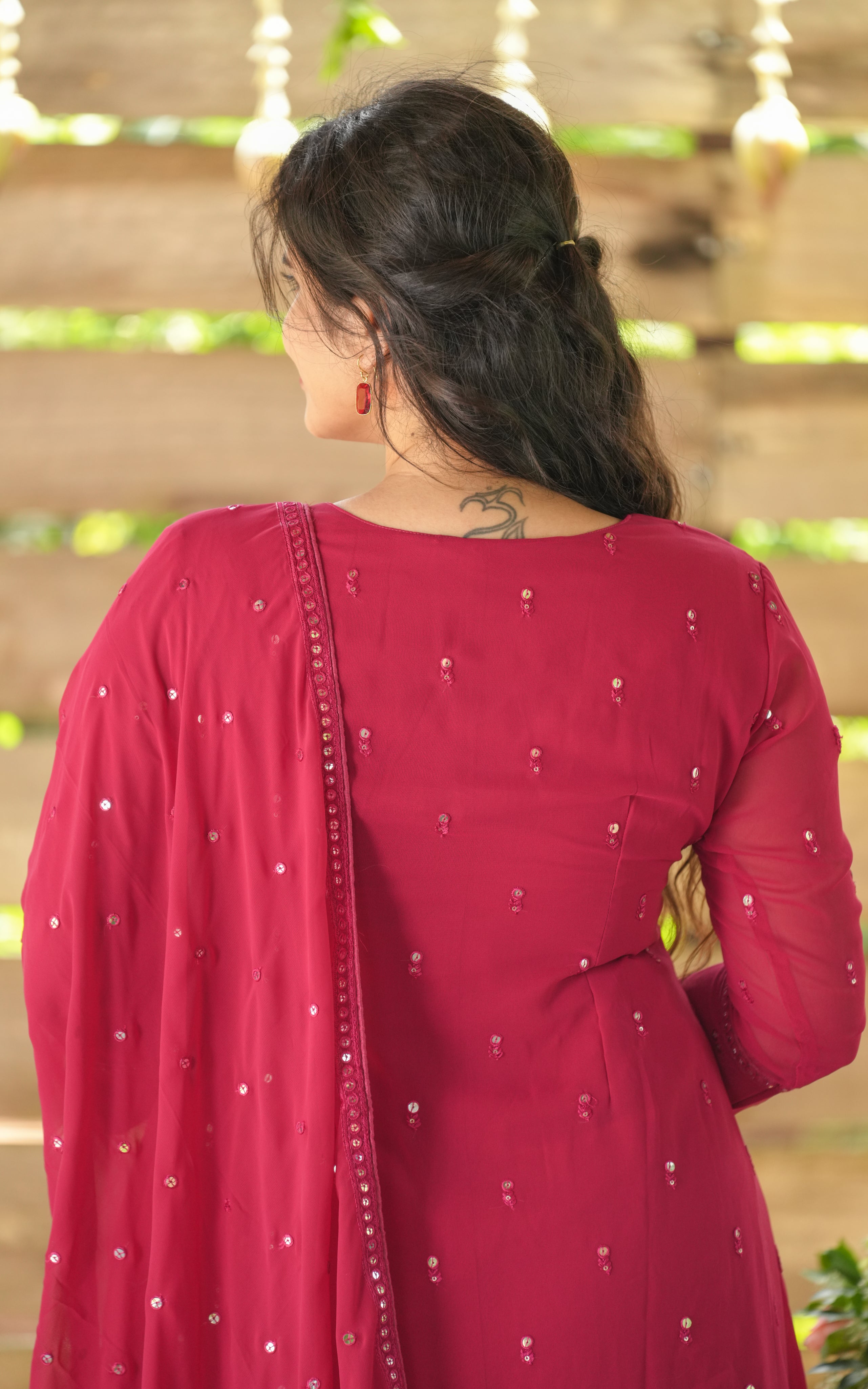 Back neckline features a modest round shape