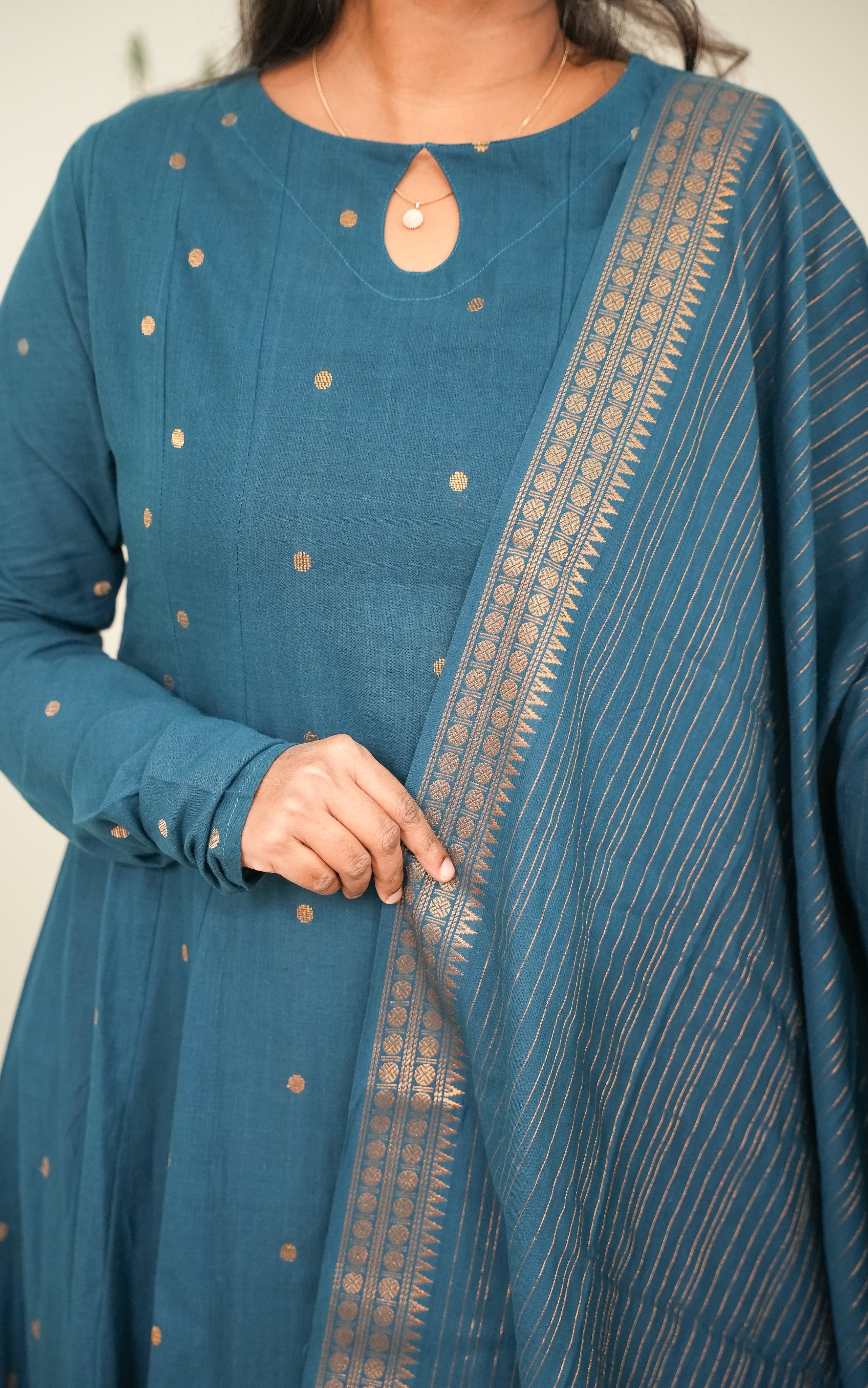 a flowing cotton dupatta with golden borders 