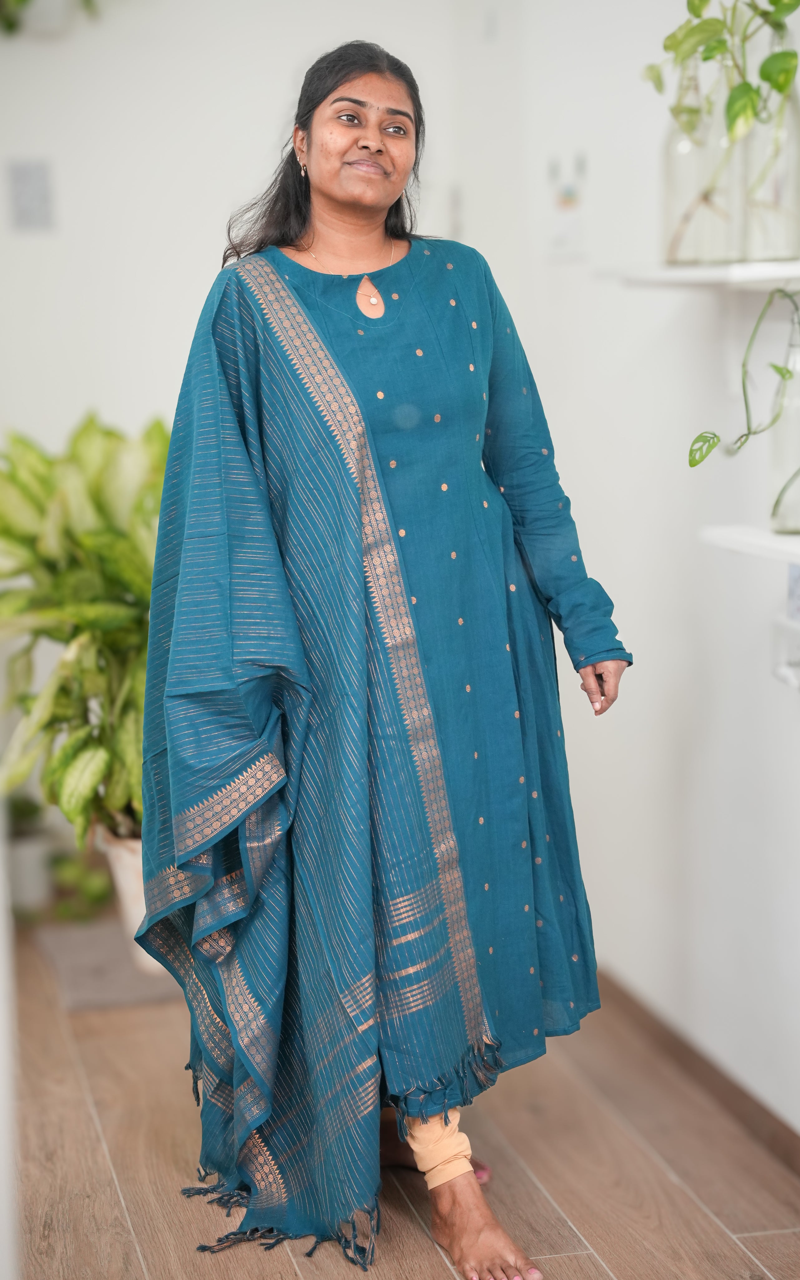 a luxurious, vibrant hue peacock blue anarkali 
