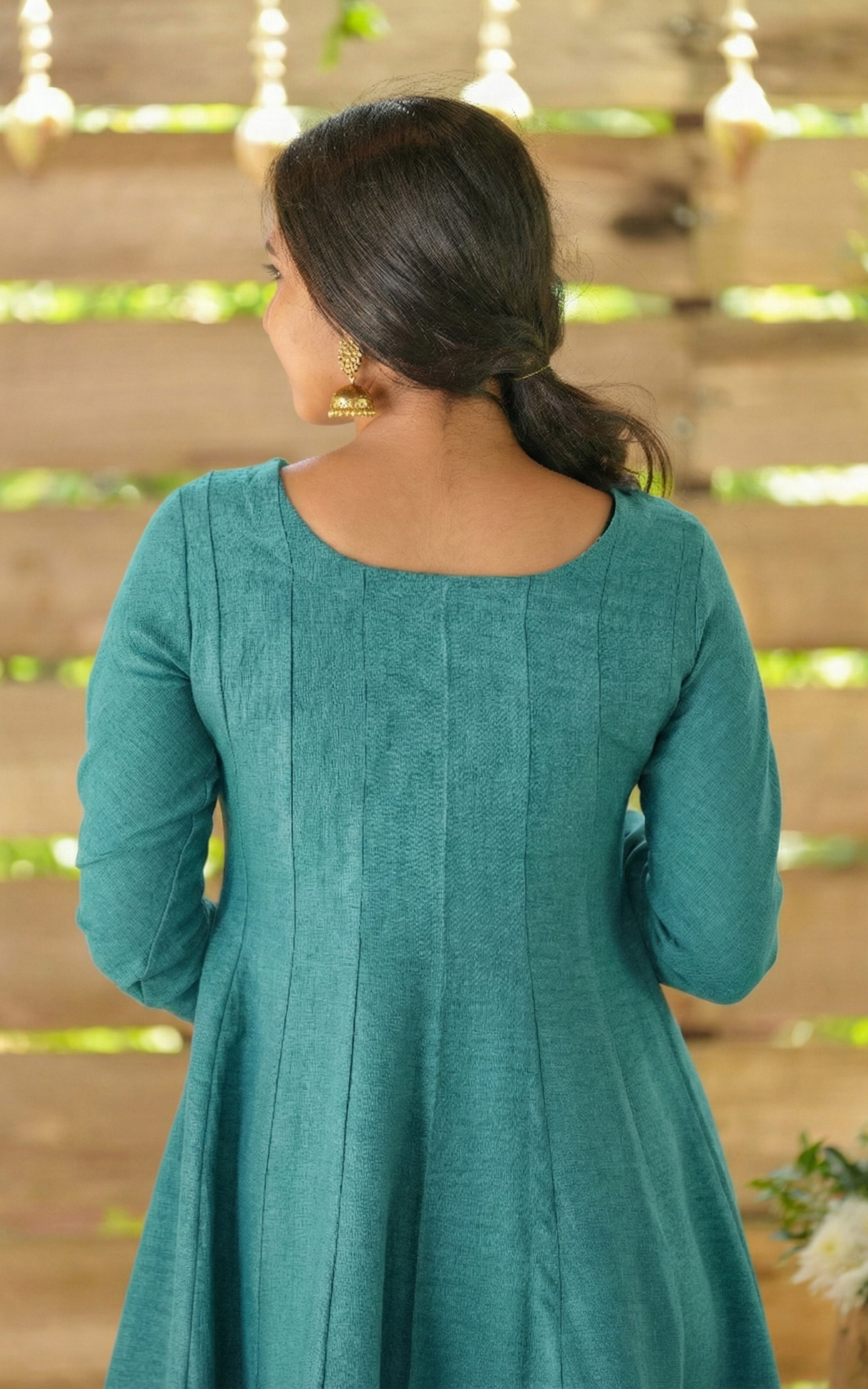 Instore - Teal Anarkali style kurti with gathered sleeves and decorative golden piping & thick slub synthetic fabric