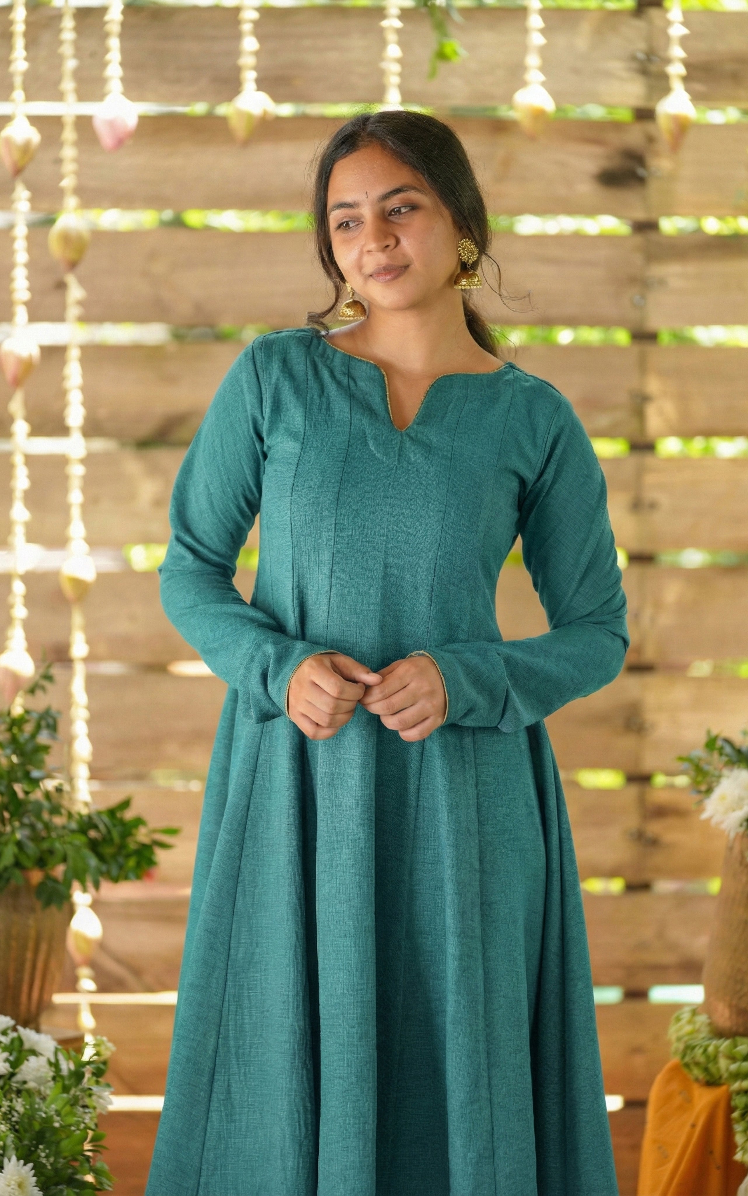Instore - Teal Anarkali style kurti with gathered sleeves and decorative golden piping & thick slub synthetic fabric