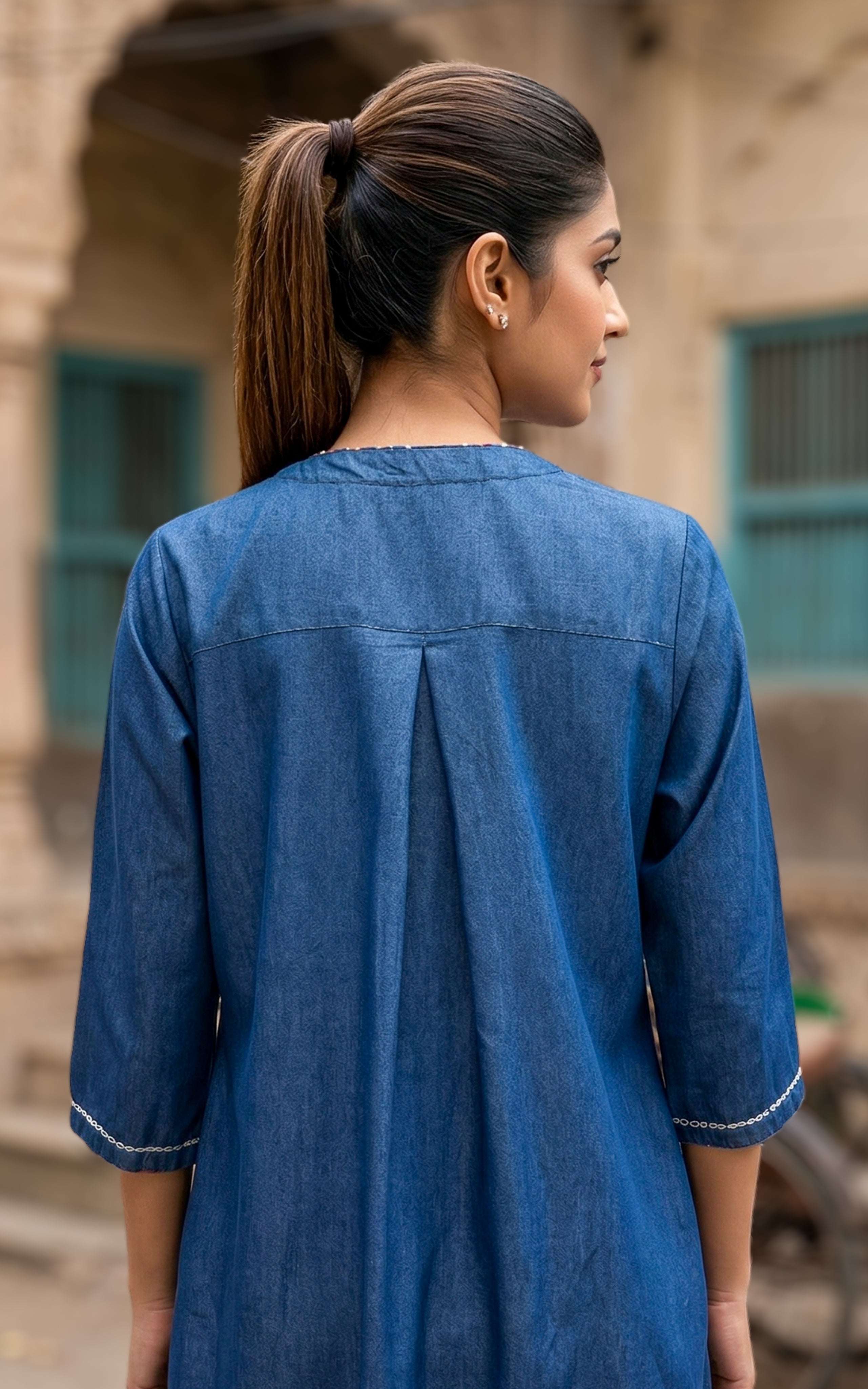 Back Neckline Features a Modest Round Shape