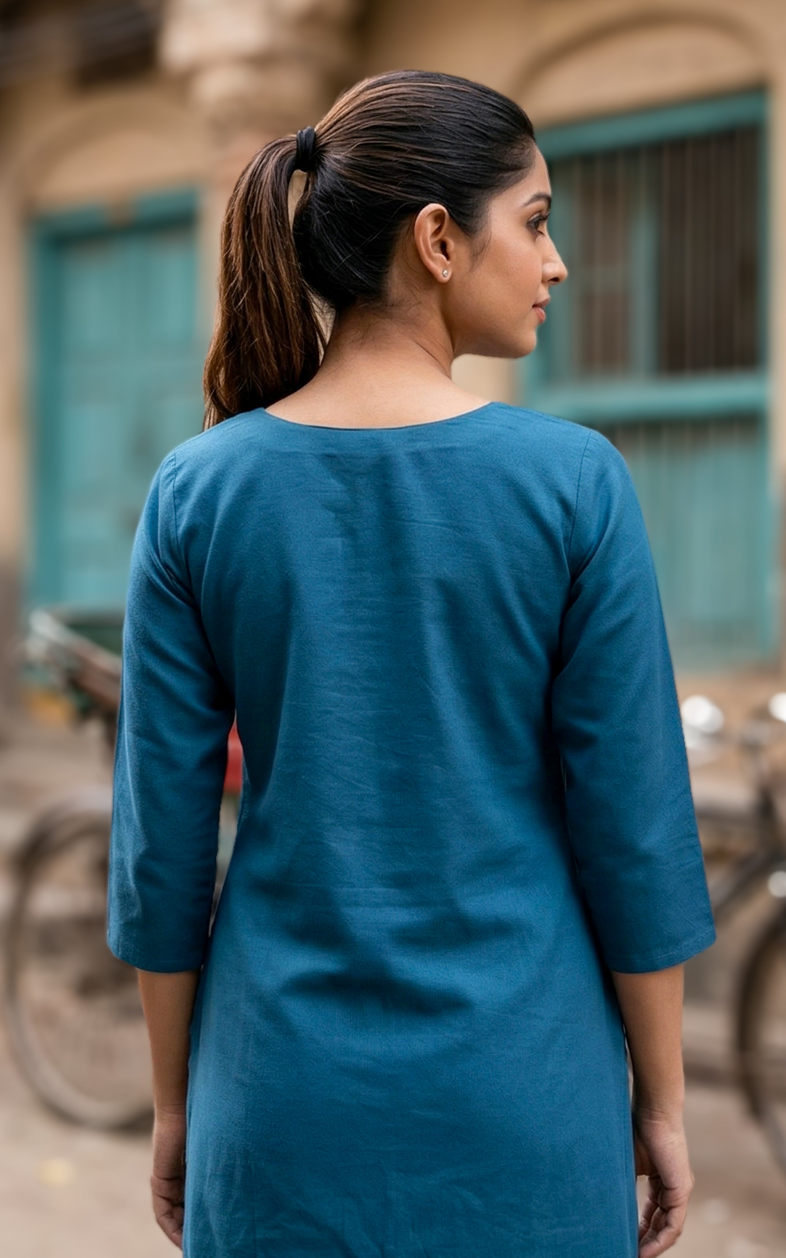 Back Neckline Features a Modest Round Shape

