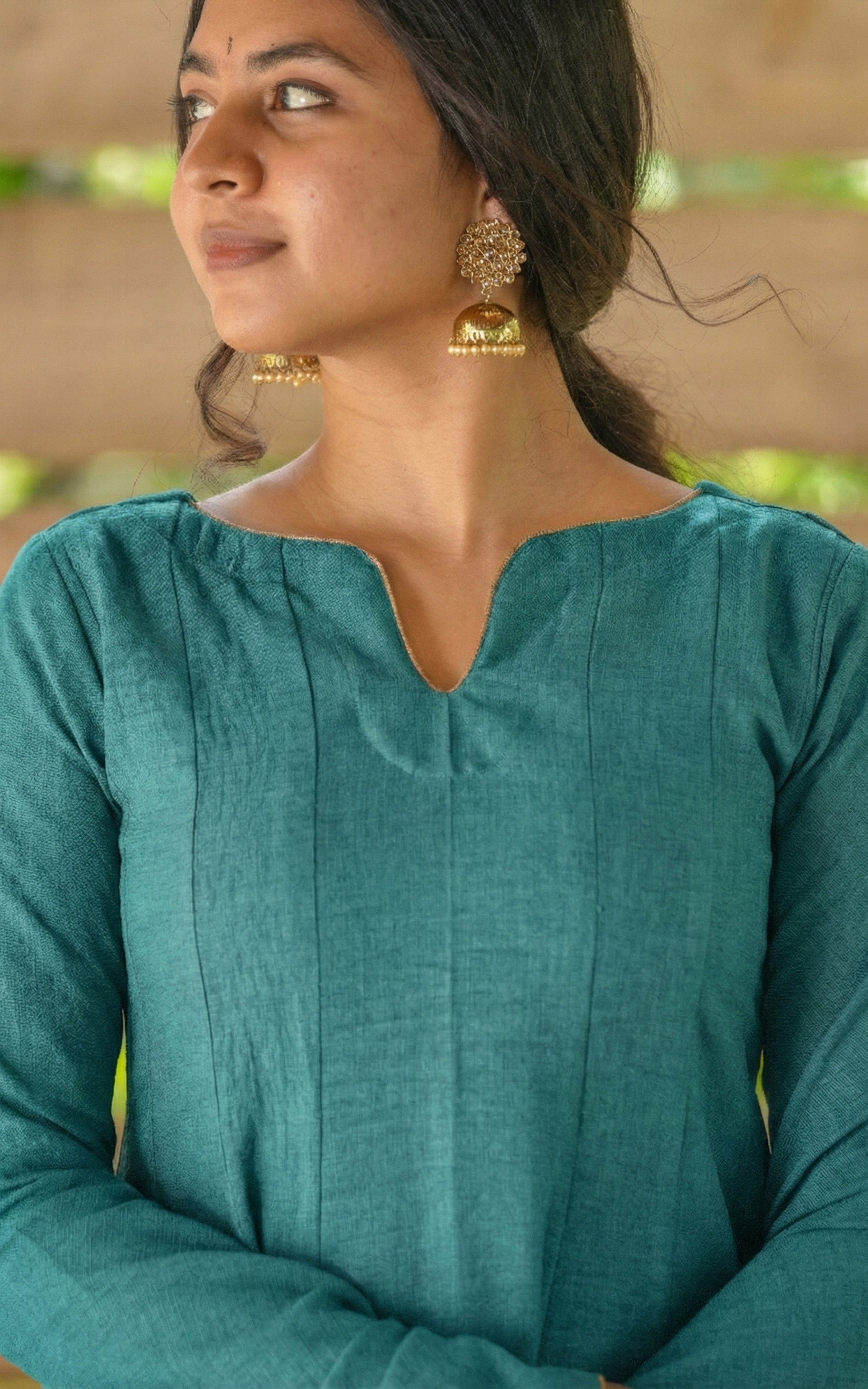 Instore - Teal Anarkali style kurti with gathered sleeves and decorative golden piping & thick slub synthetic fabric
