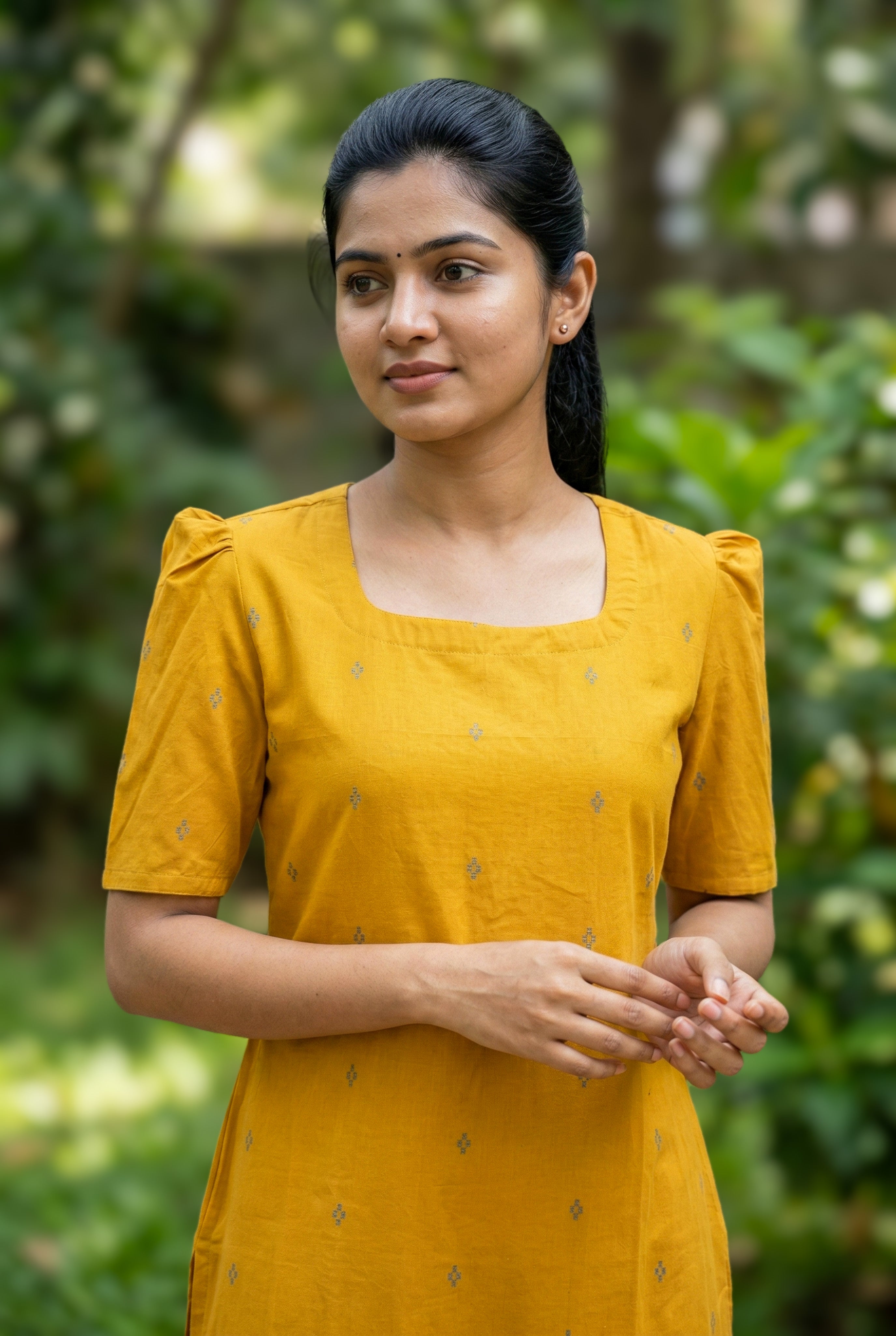 mustard ethnic south cotton kurti
designer cotton kurti with puff sleeves
festive cotton kurti for women
traditional straight cut kurti with side slit