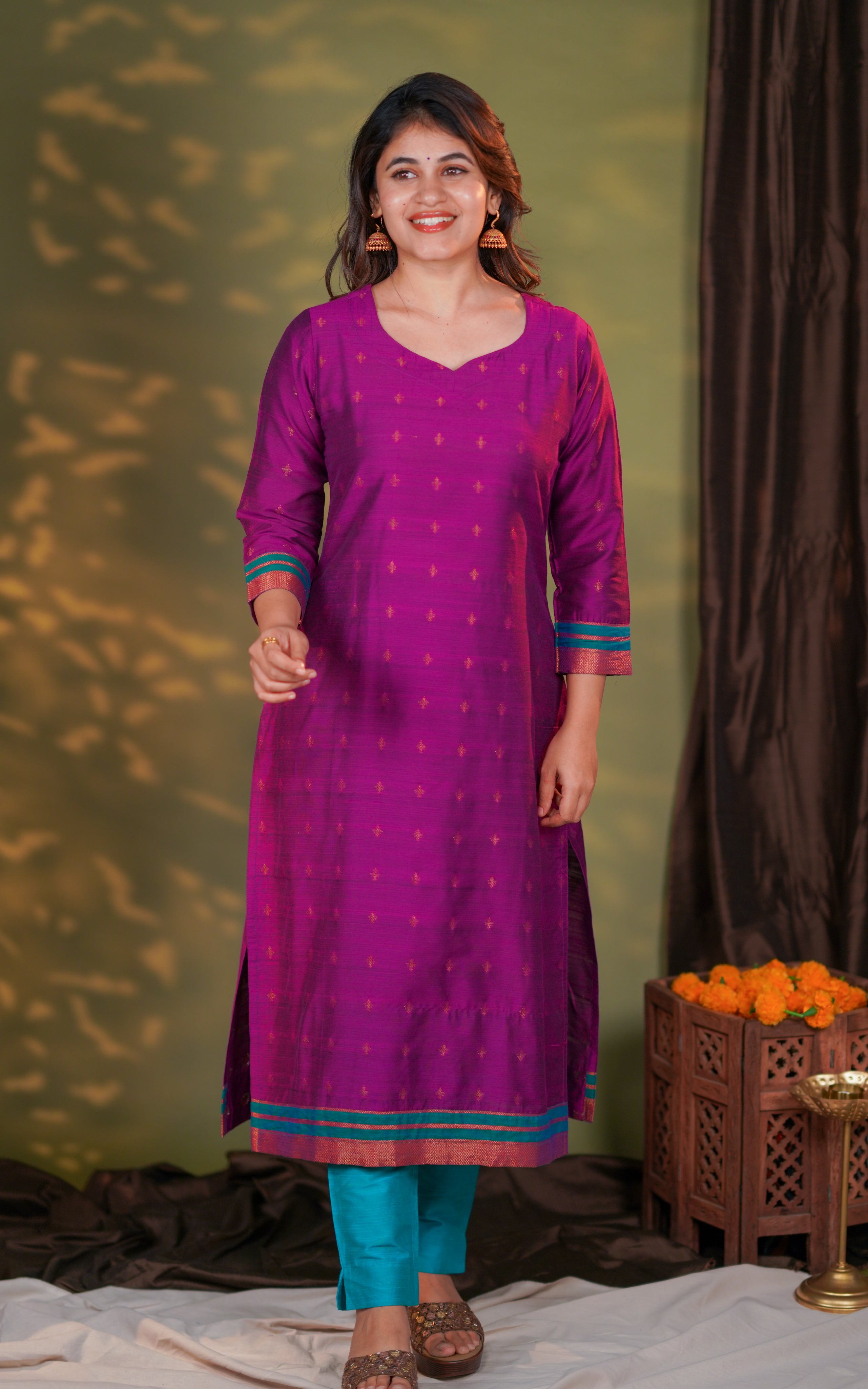 The straight-cut silhouette offers a sleek, structured look suitable for both casual and festive styling.