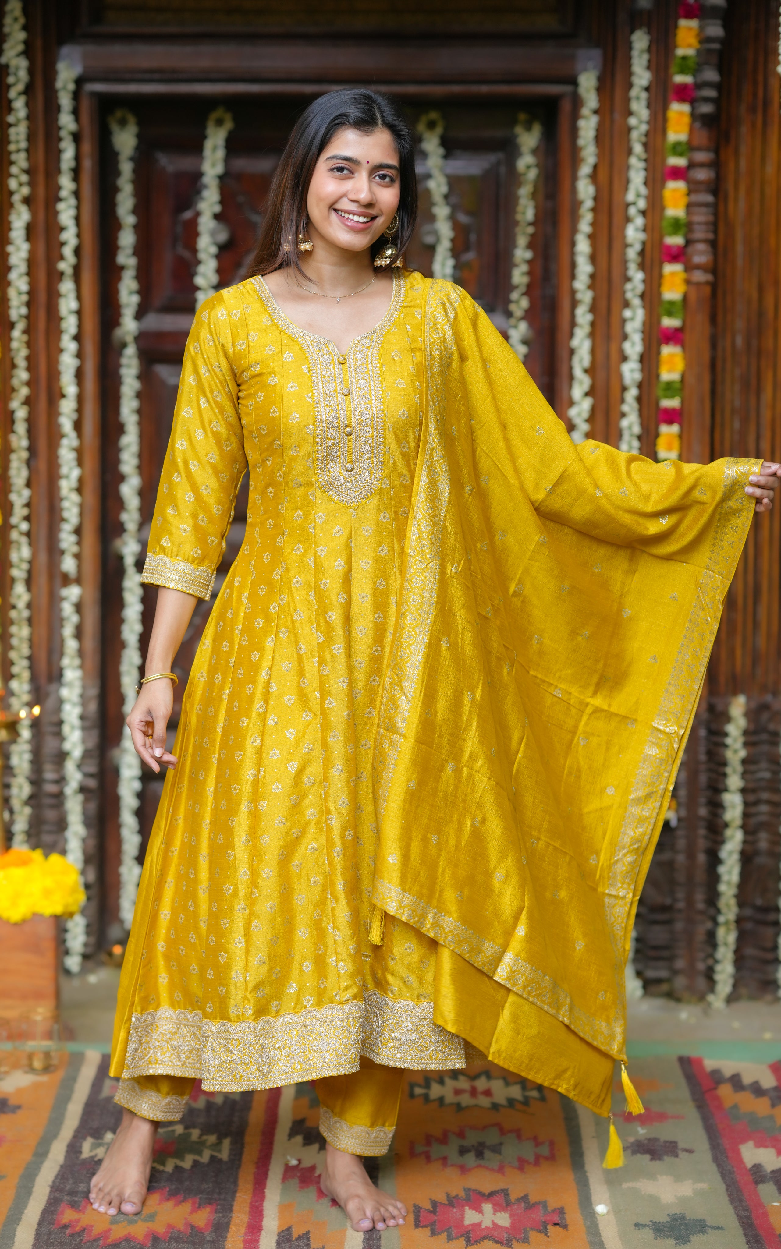  Complete festive elegance in a coordinated A-line kurti, pant, and dupatta set.