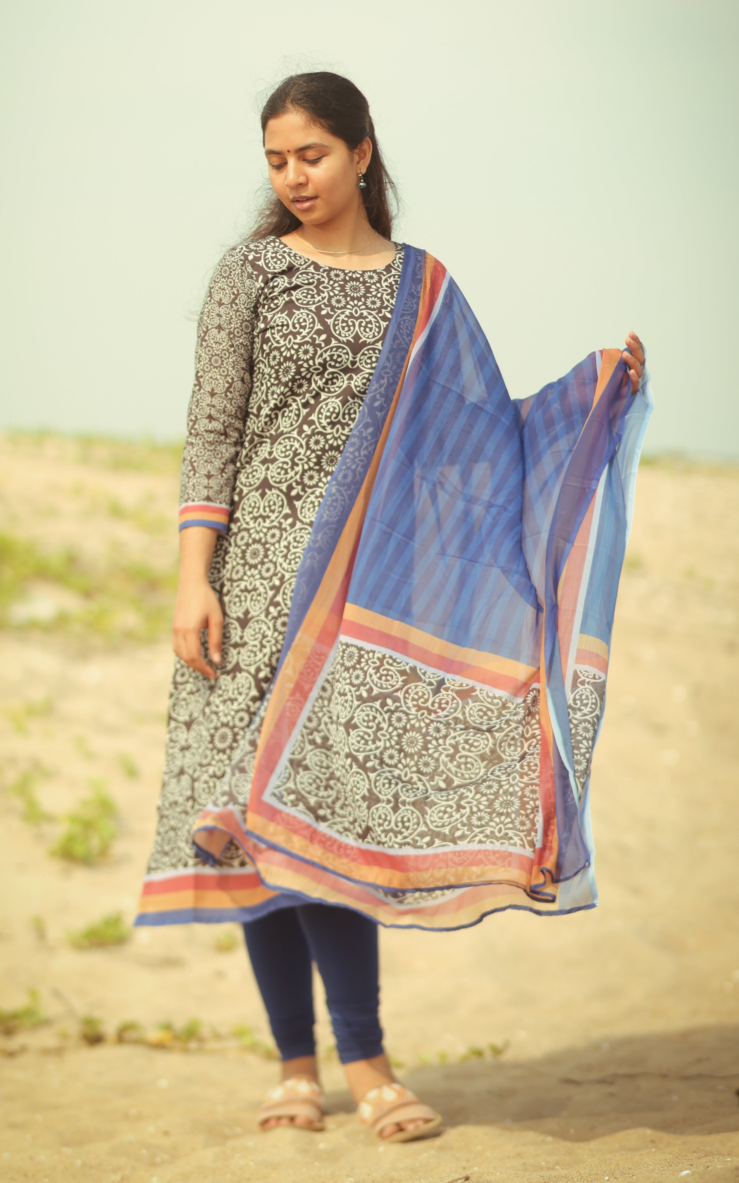  Straight cut black and blue printed cotton kurti with side slits and a dupatta.